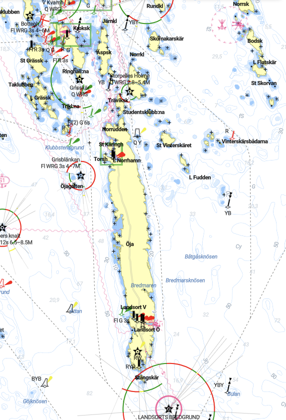 Detailed nautical chart of a shipping route including islands, navigation aids, and boat symbols, with various markers and depth contours.