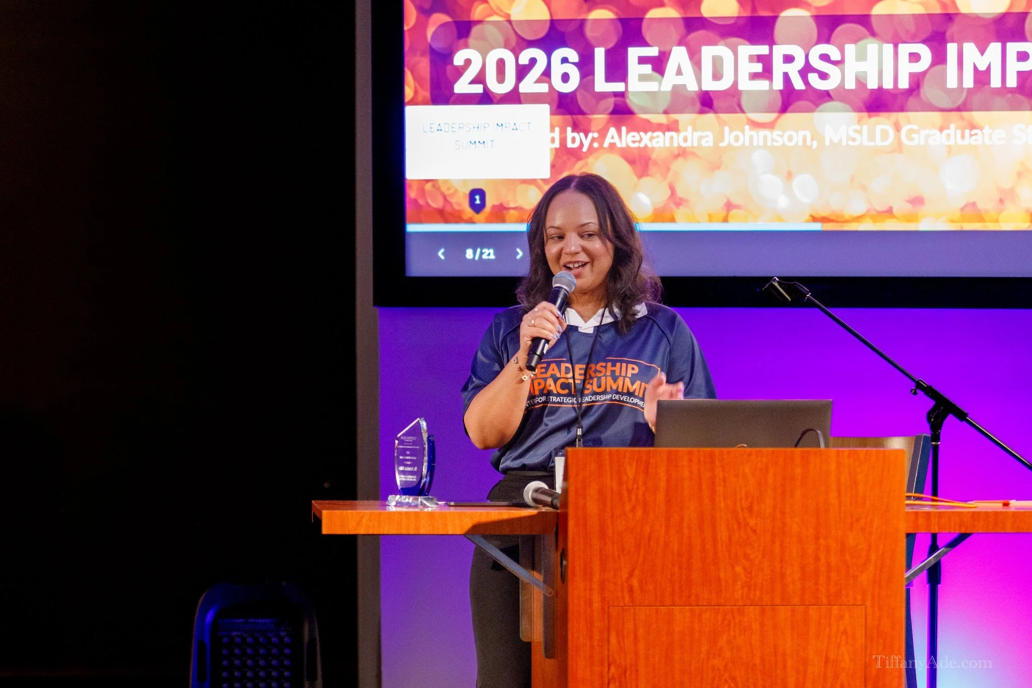 Alex Johnson speaking at the 2026 Leadership Impact Summit, delivering a keynote presentation on leadership development