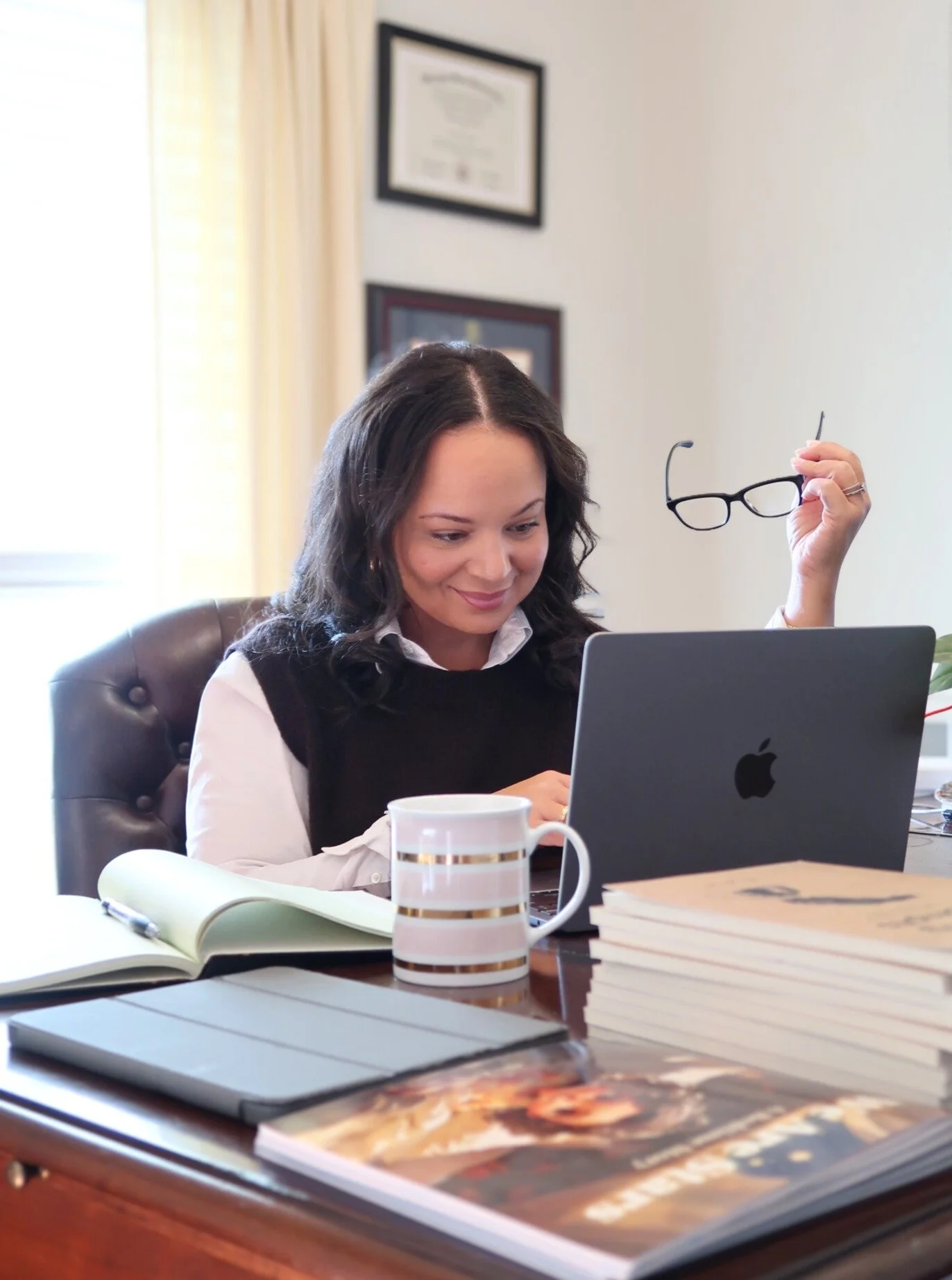 Alex Johnson, founder of Johnson Leadership Development, preparing leadership development materials at her workspace in metro Atlanta