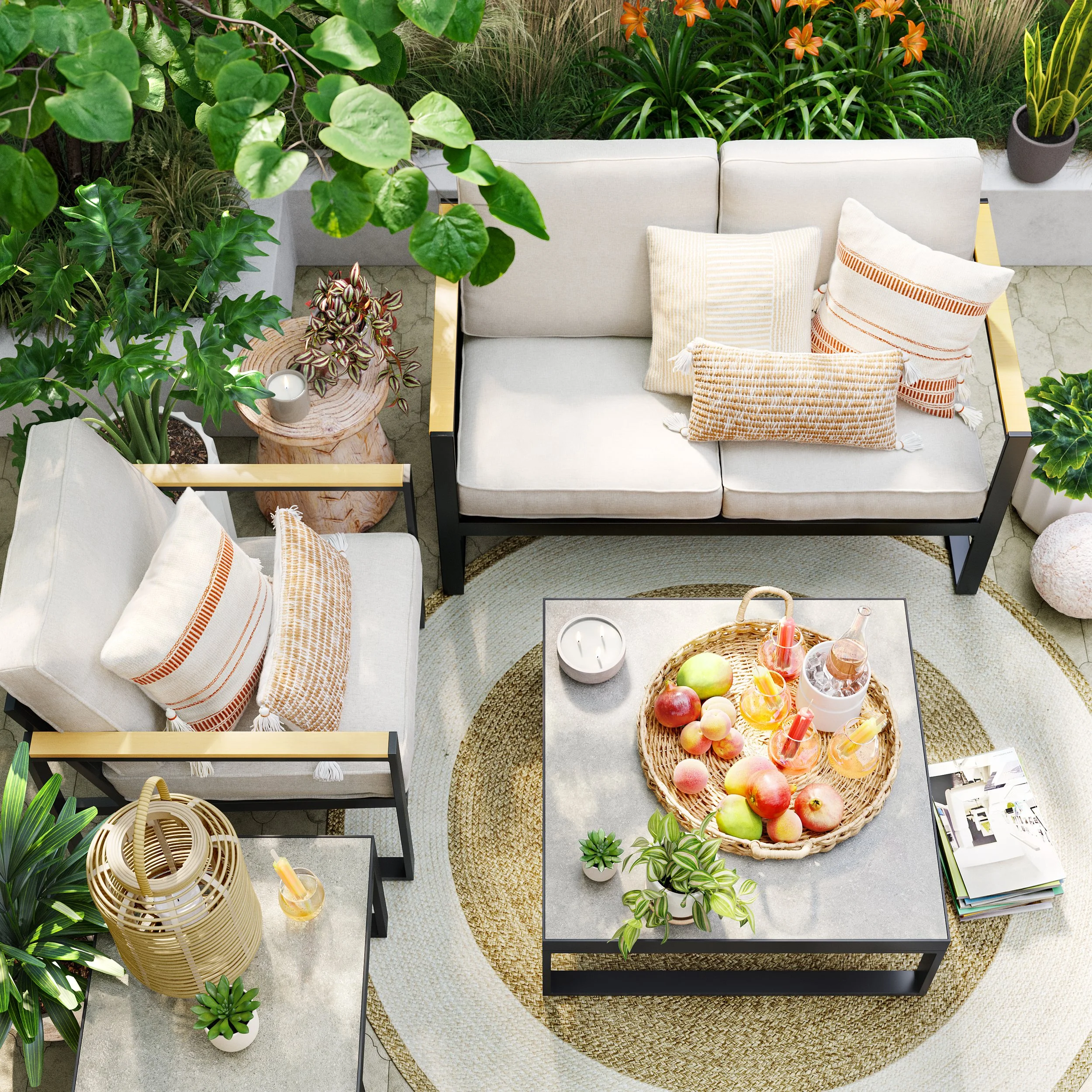 A cozy outdoor patio living space with cream-colored sofas and throw pillows, surrounded by lush green plants, a round rug, and a coffee table with apples, peaches, and glass drinks.