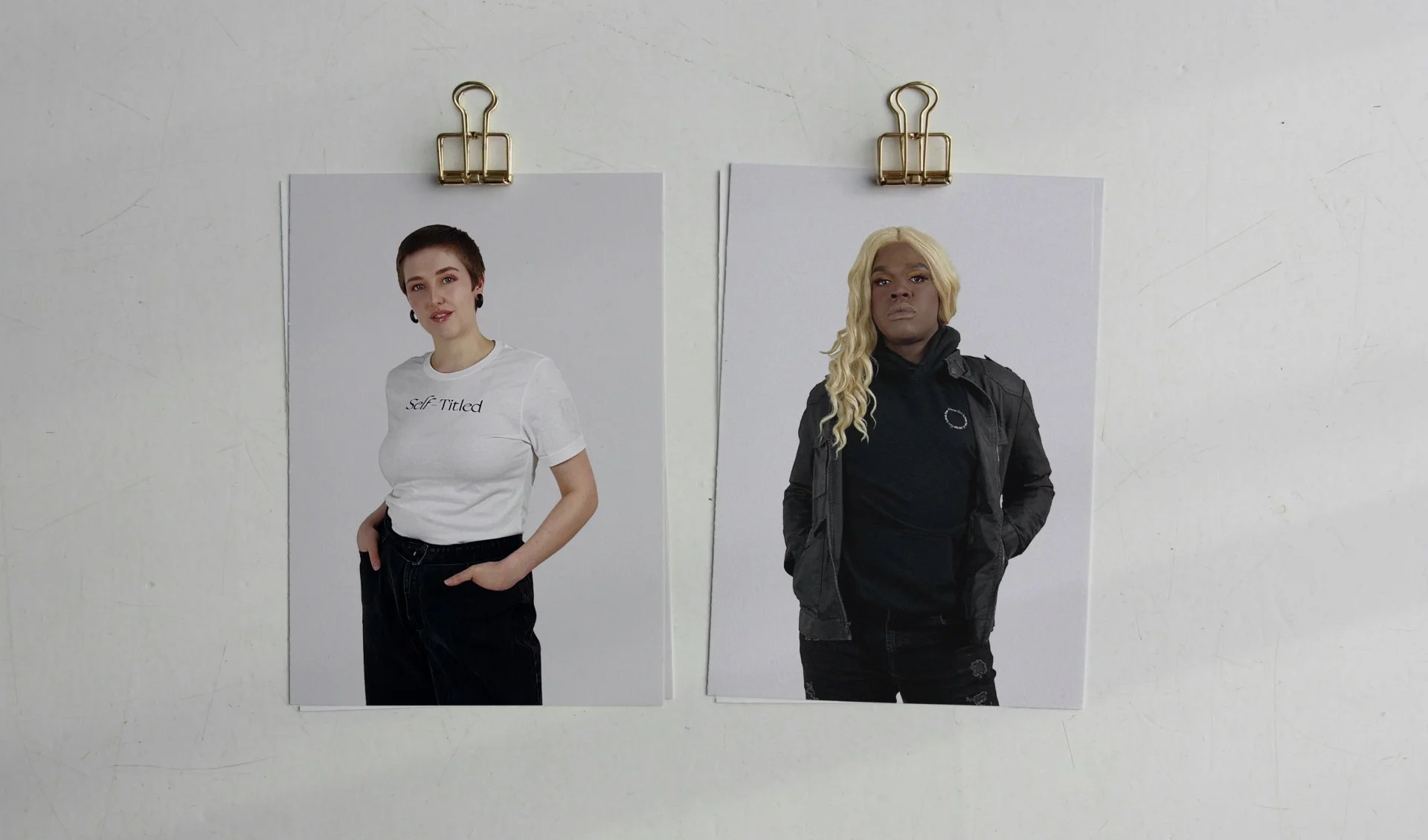 Two fashion portraits clipped to a white background, showcasing diverse models in modern apparel. A minimalist editorial emphasizing inclusivity and contemporary styling.