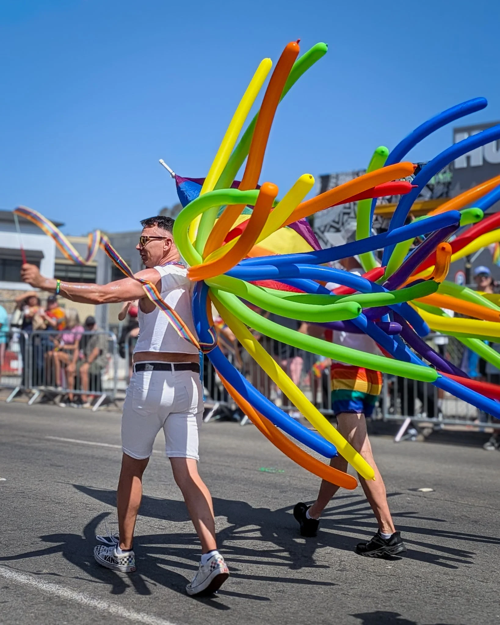A parade participant performs with a colorful balloon costume along the parade route.
San Diego, CA | © Edge of Clarity Photo | Elizabeth Chaney 2026