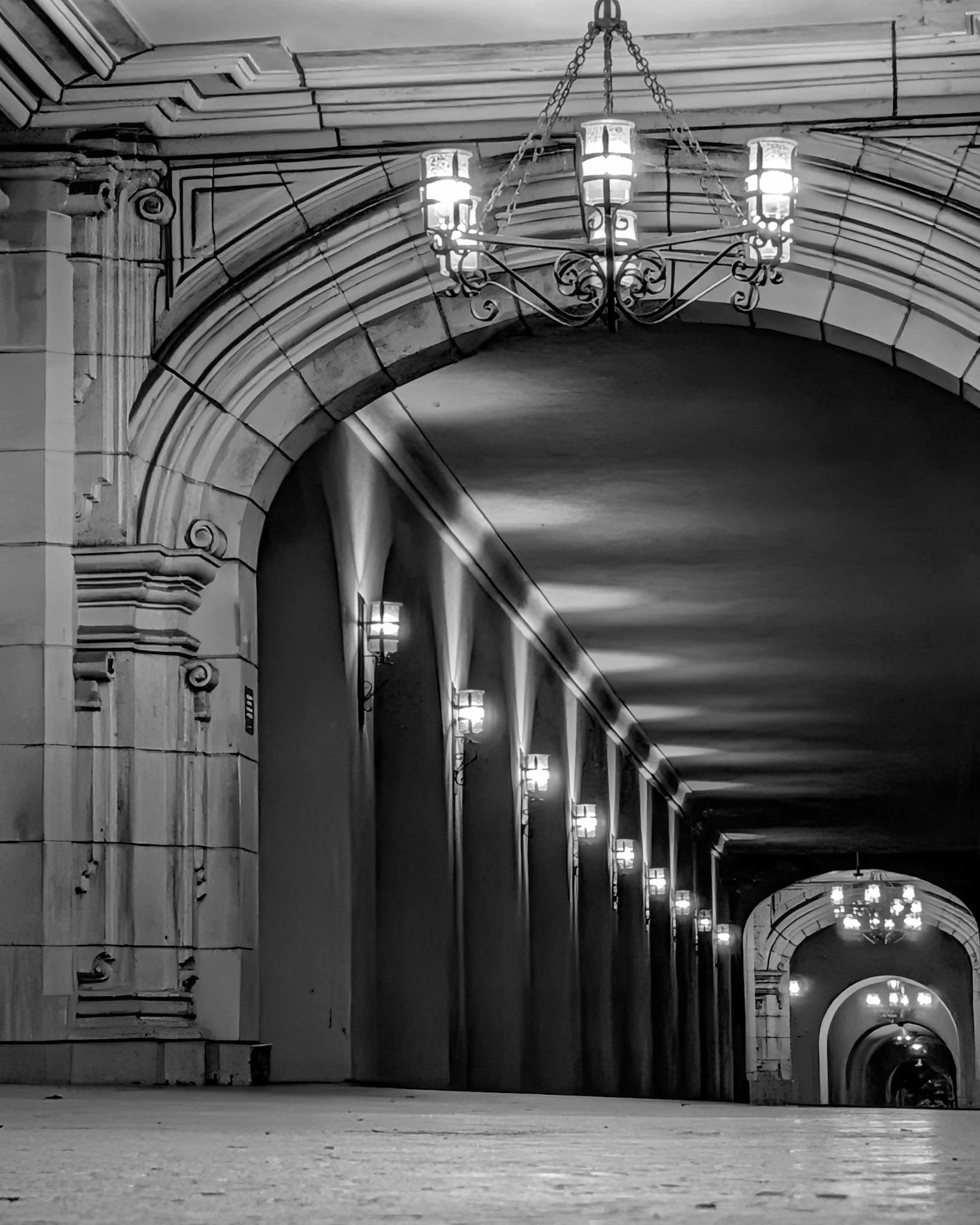 Black and white photo in a Balboa Park promenade at night. San Diego, CA | © Edge of Clarity Photo | Elizabeth Chaney 2026