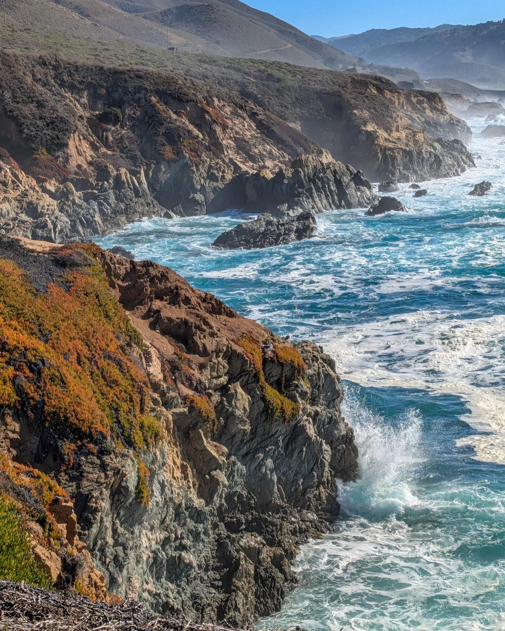 ocean waves crashing against rocky coastal cliffs landscape photography