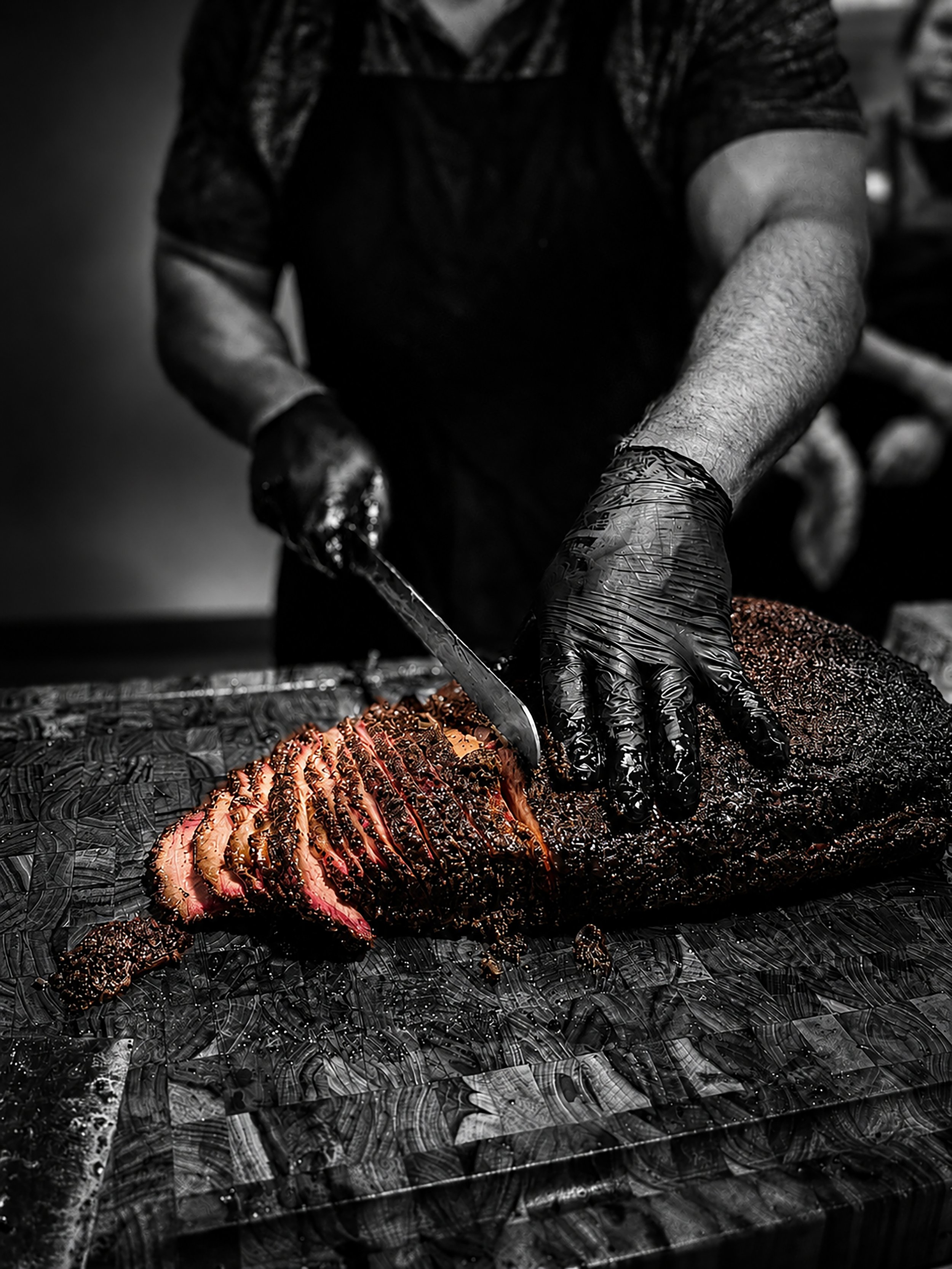 Smoke On The Water Salibsury MA Carving a large piece of smoked brisket