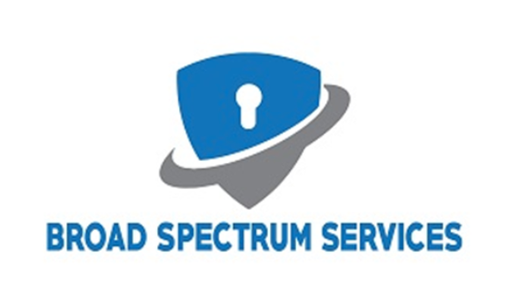 Logo of Broad Spectrum Services featuring a blue shield with a keyhole symbol and a gray swoosh, with the company name below.