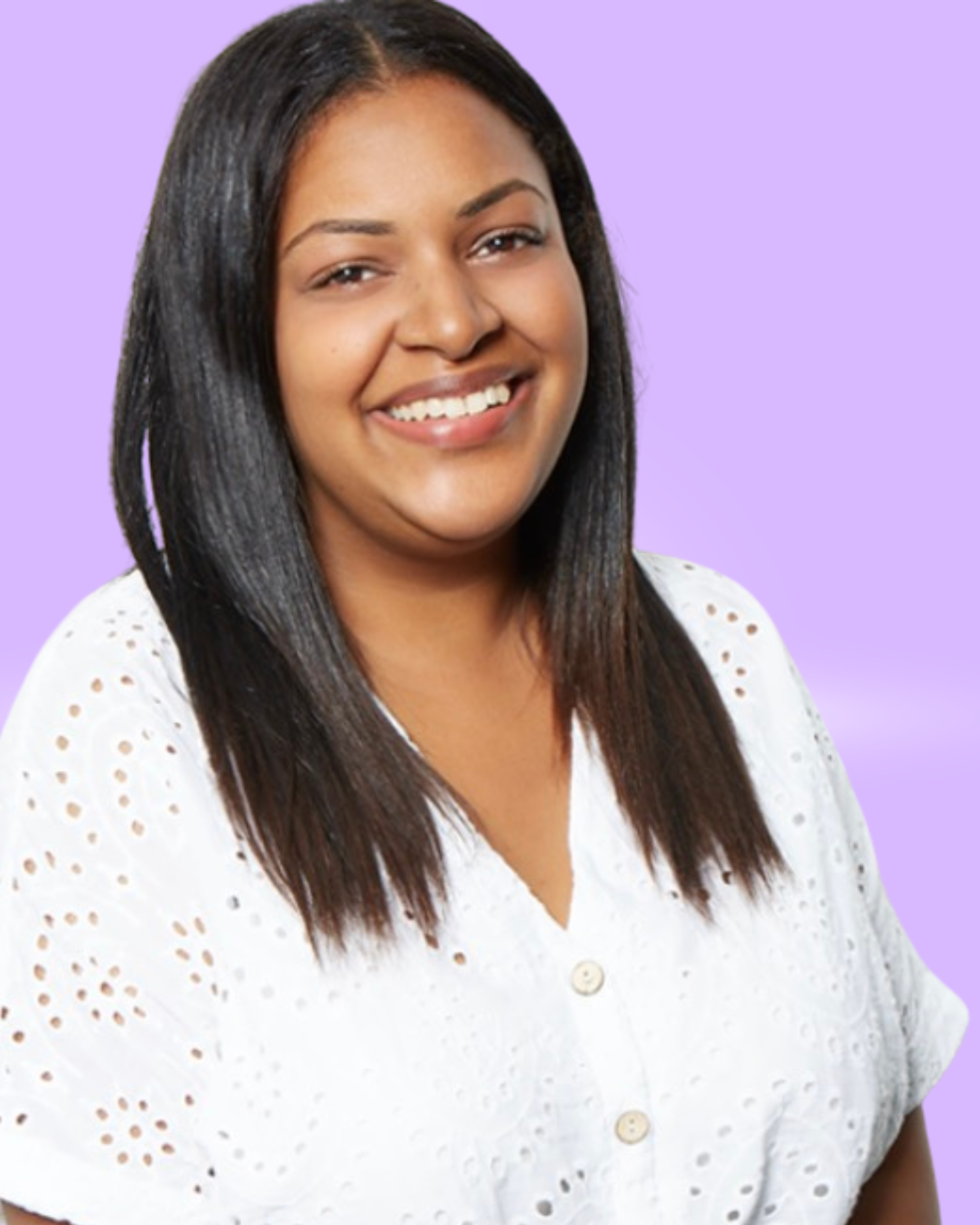 A woman with long dark hair smiling, wearing a white blouse with cutout details, standing against a light purple background.