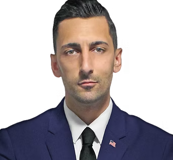 Portrait of a man in a navy suit, white shirt, and black tie against a plain background.