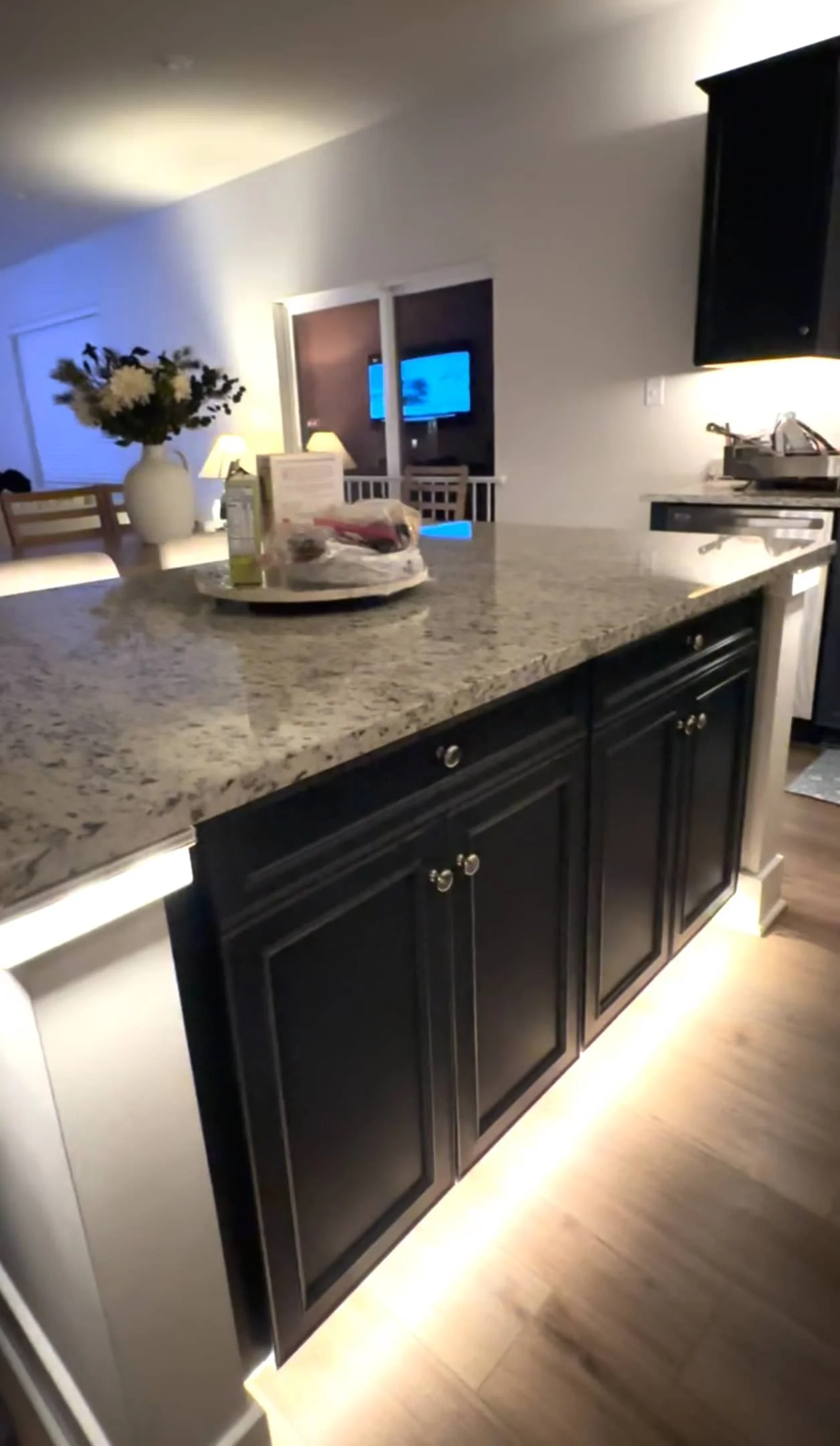 Under-cabinet LED strip lighting for a modern kitchen in a DMV area home, starting at $1,500.