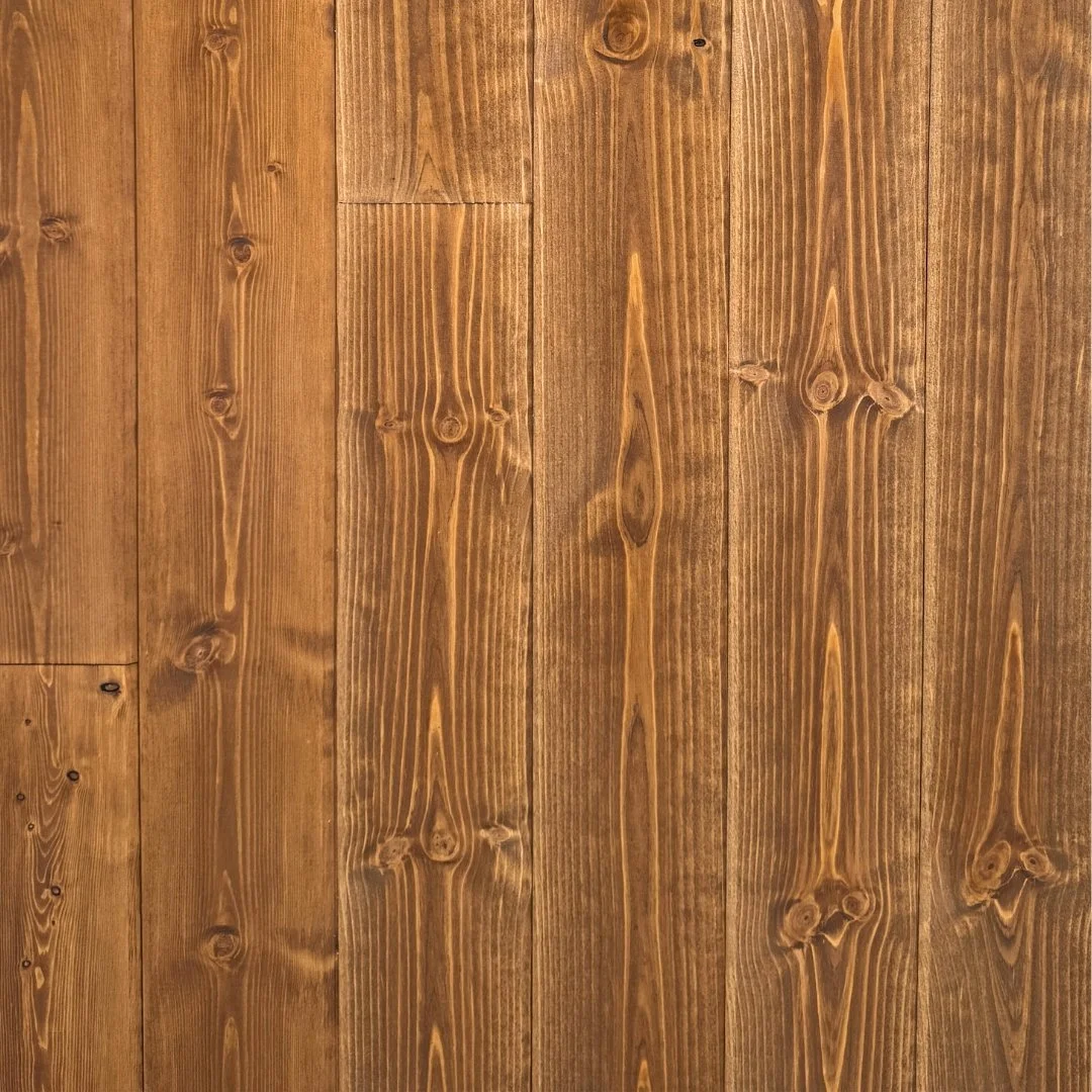 Premier Plank Single Barrel factory-finished European Pine vertical paneling with visible grain and knot detail.