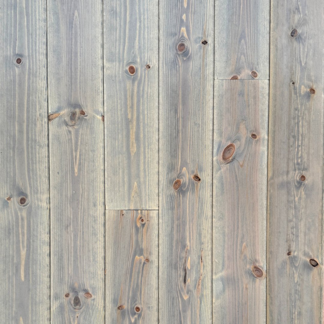 Premier Plank Smoky Reserve factory-finished European Pine paneling with weathered gray-brown finish and natural knot structure.