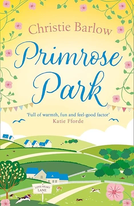 Book cover for 'Primrose Park' by Christie Barlow featuring a colourful illustration of a countryside landscape with trees, houses, rolling hills, and a sky with birds and bunting.