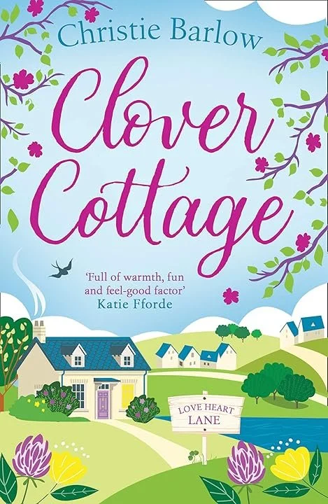 Book cover for 'Clover Cottage' by Christie Barlow featuring a colourful countryside scene with houses, trees, flowers, and a pond.