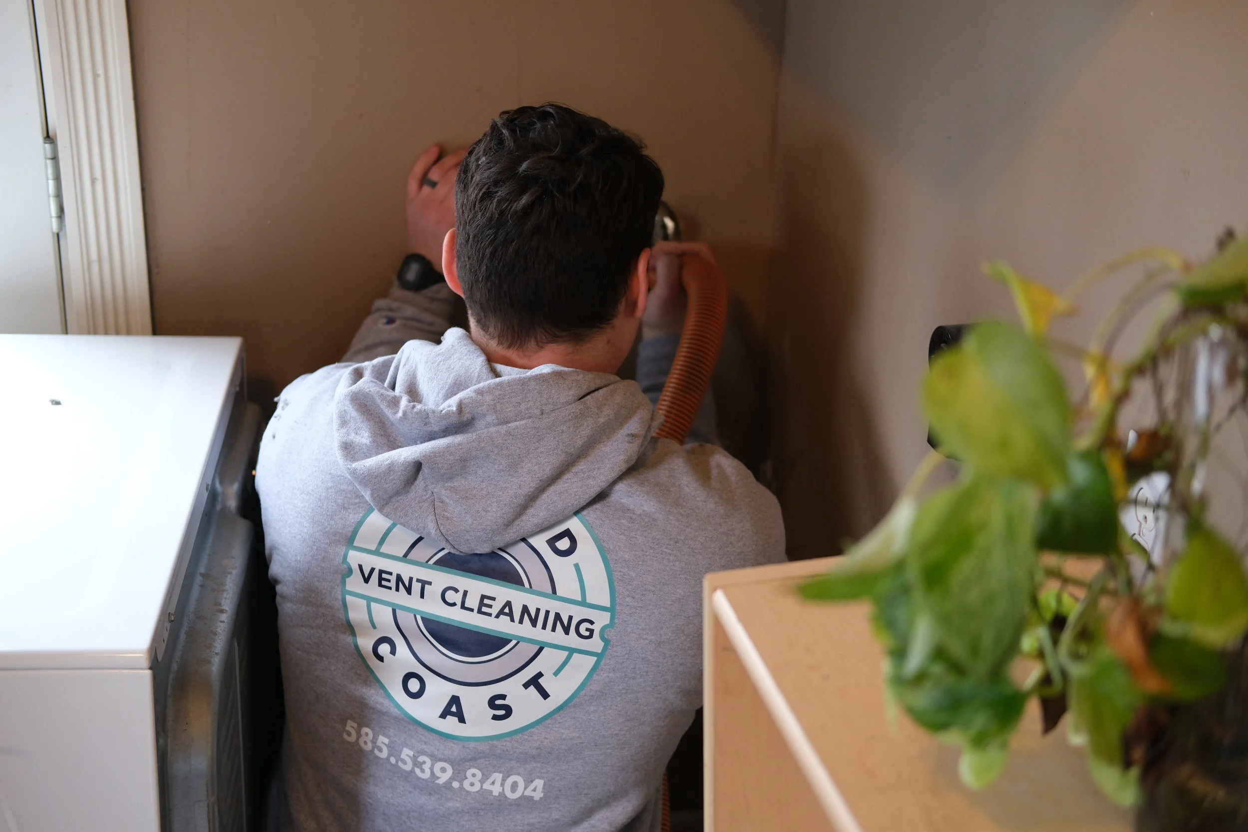 Third Coast Vent Cleaning technician cleaning dryer vent in Wayne County NY