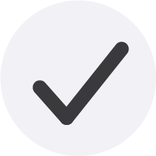 A check mark inside a gray circle on a white background.
