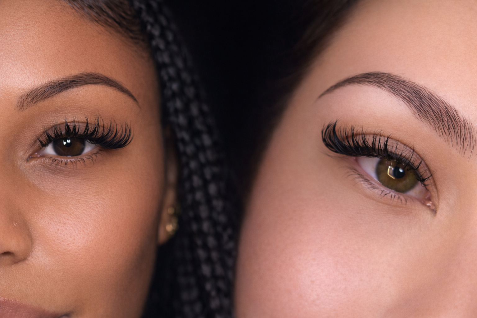 Close-up of two women's eyes with long eyelashes, one with dark braided hair and the other with straight hair, showing detailed eyebrows and skin texture. Aura by Joogie real clients and real testimonials.
