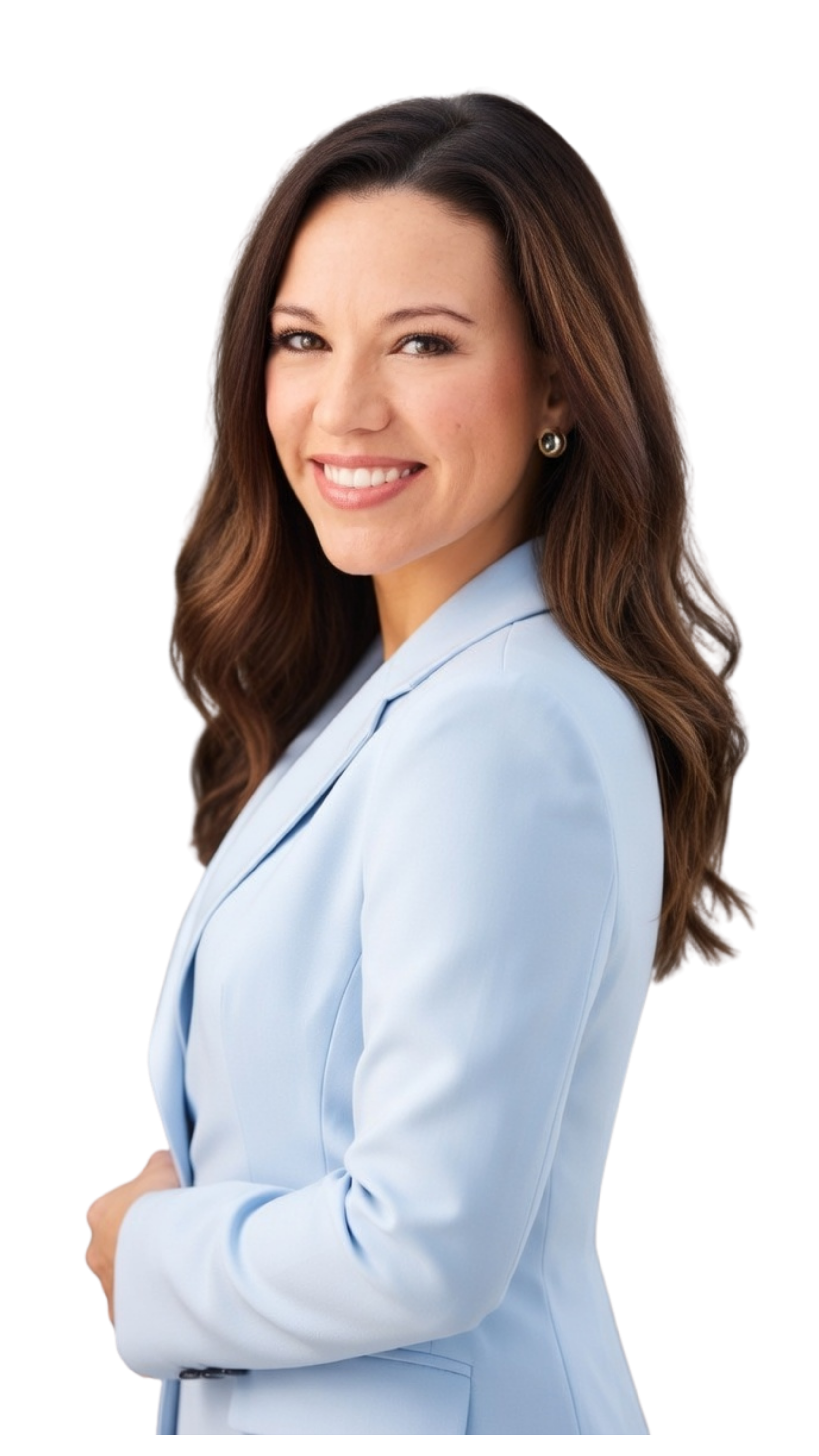 A smiling woman with brown, wavy hair, wearing a light blue blazer and pearl earrings, with arms crossed, against a black background.