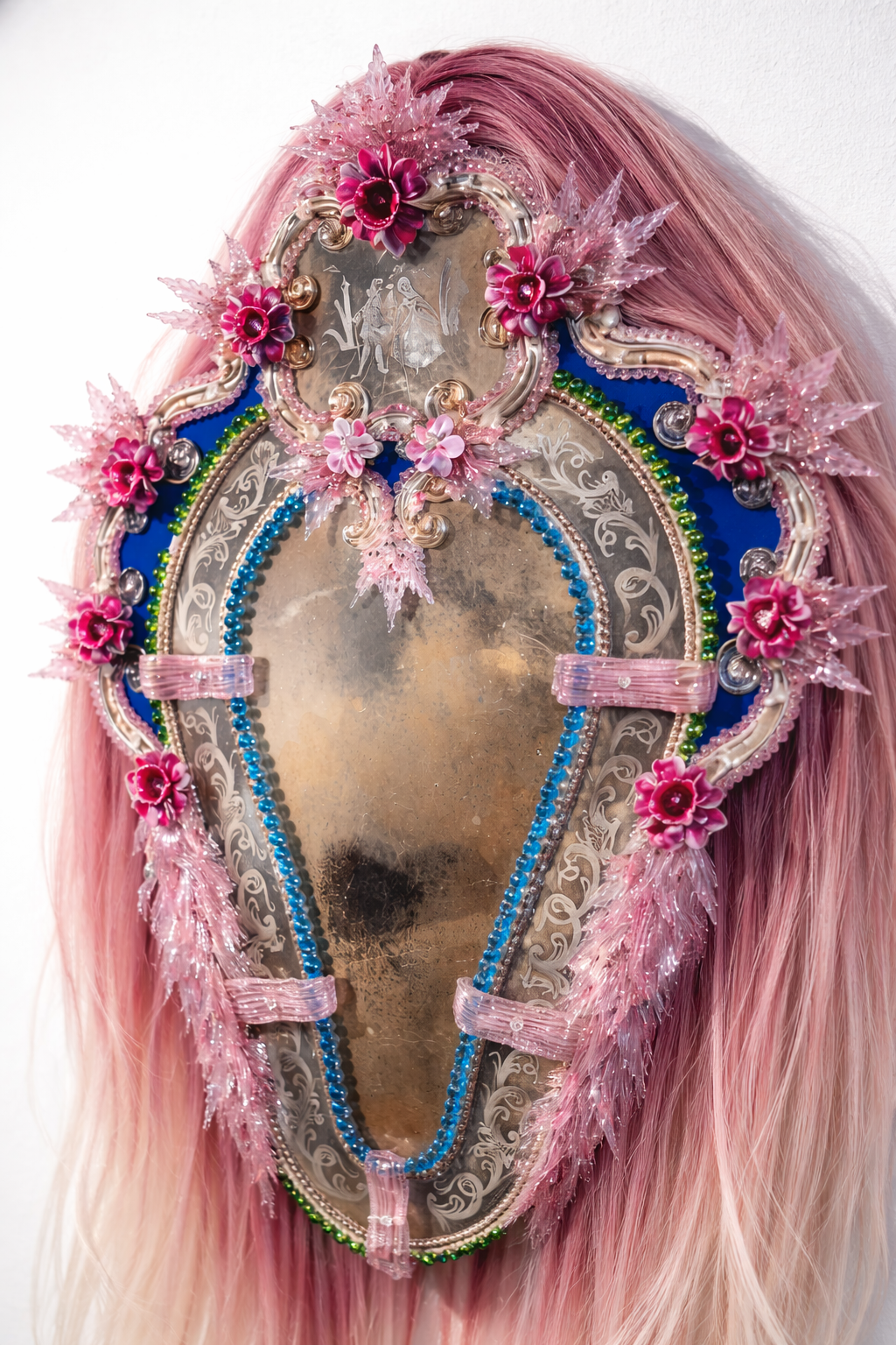 Decorative mirror with human hair and floral elements, sculptural object by Vigo Leonarte