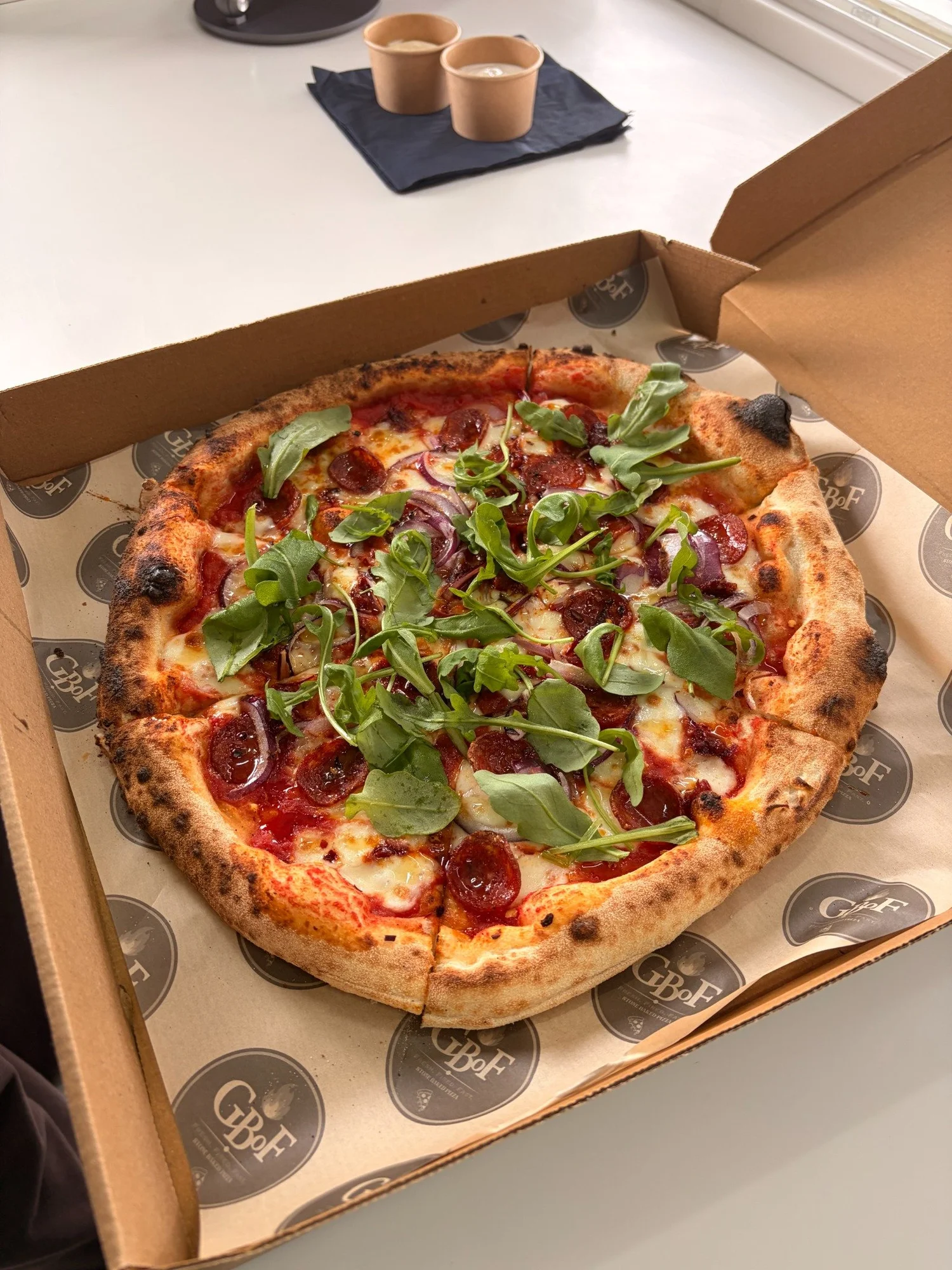 GBoF pizza topped with rocket, pepperoni and red onion