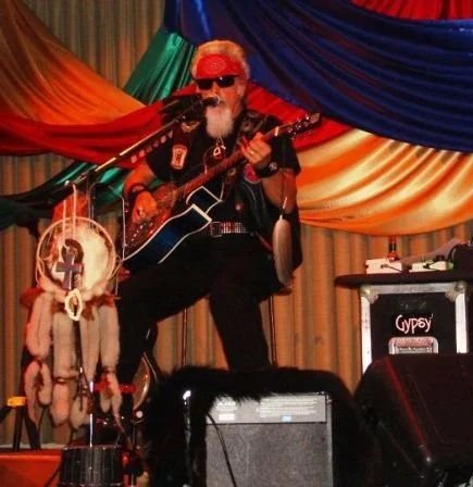 In concert as the Solo artist - Stompbox, Dobro, harmonica and vocals.