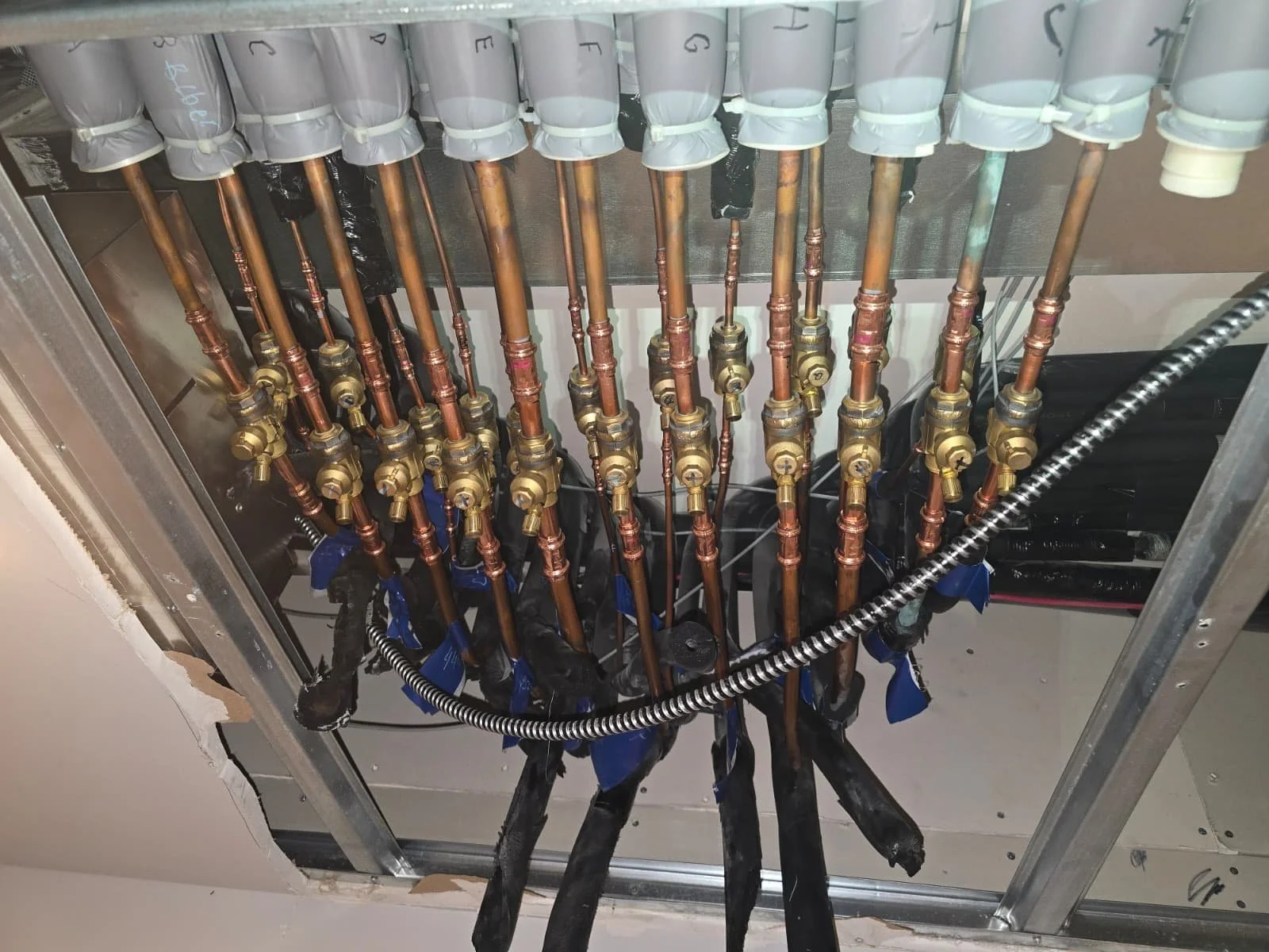 Commercial plumbing manifold installation NYC, mechanical systems coordination by licensed master plumber, Hattan Contracting