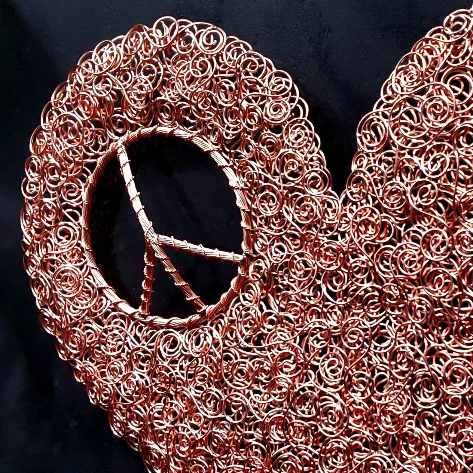 copper-coil-peace-sign-heart-close-bright