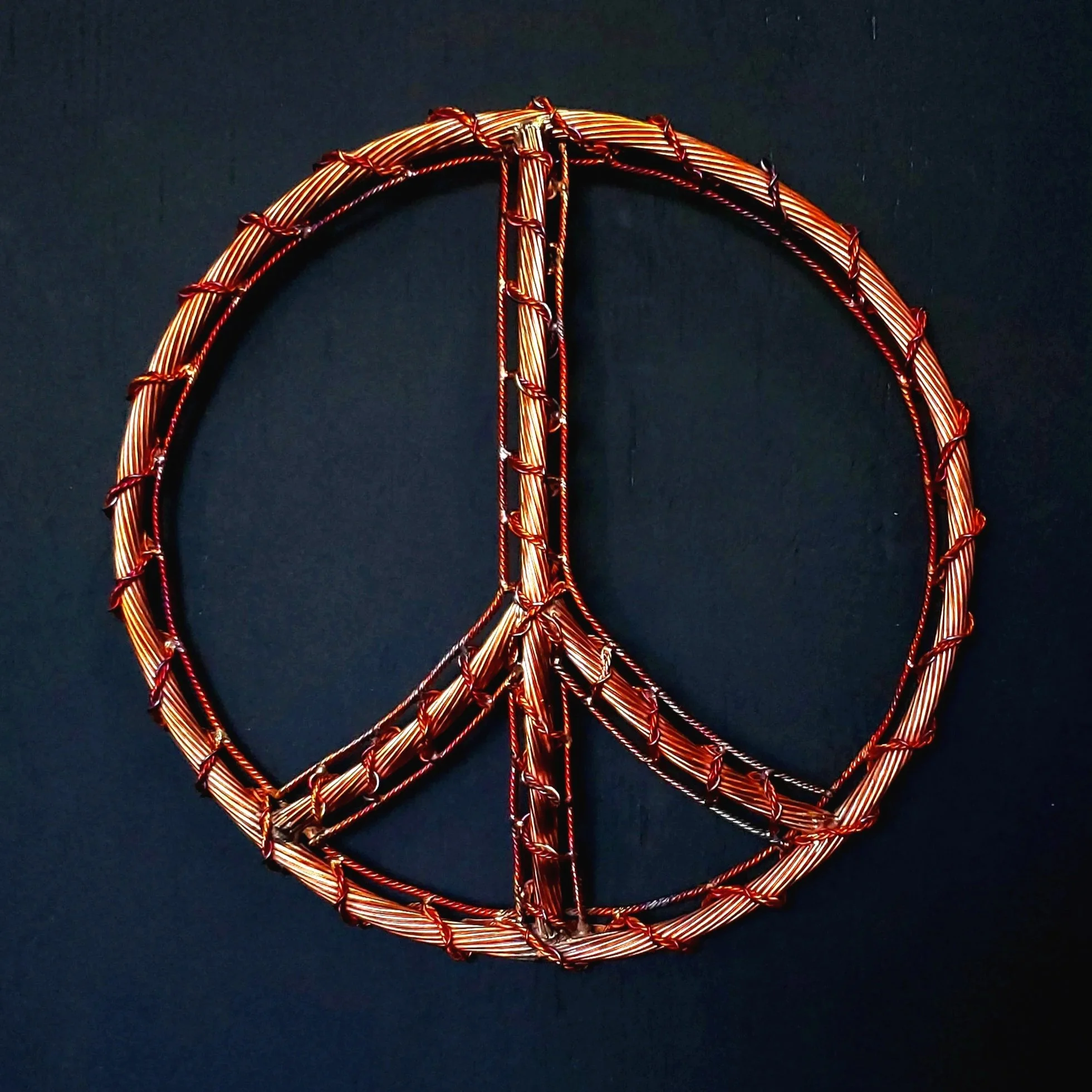 harmony-copper-wire-peace-sign-flamed-front