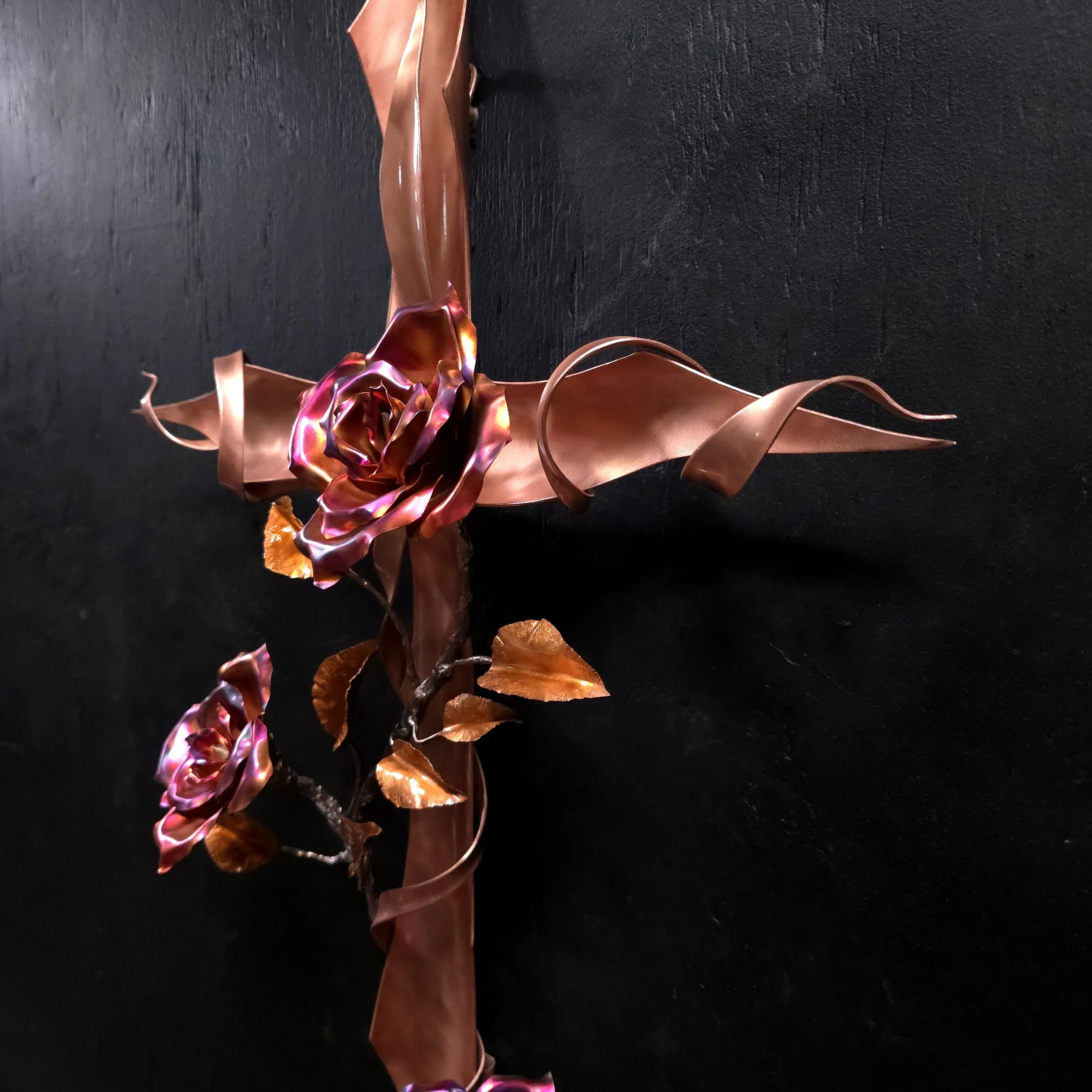 polished-copper-cross-with-vining-roses-center-right