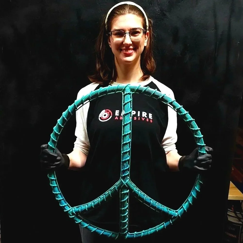 copper-wire-peace-sign-patina-holding