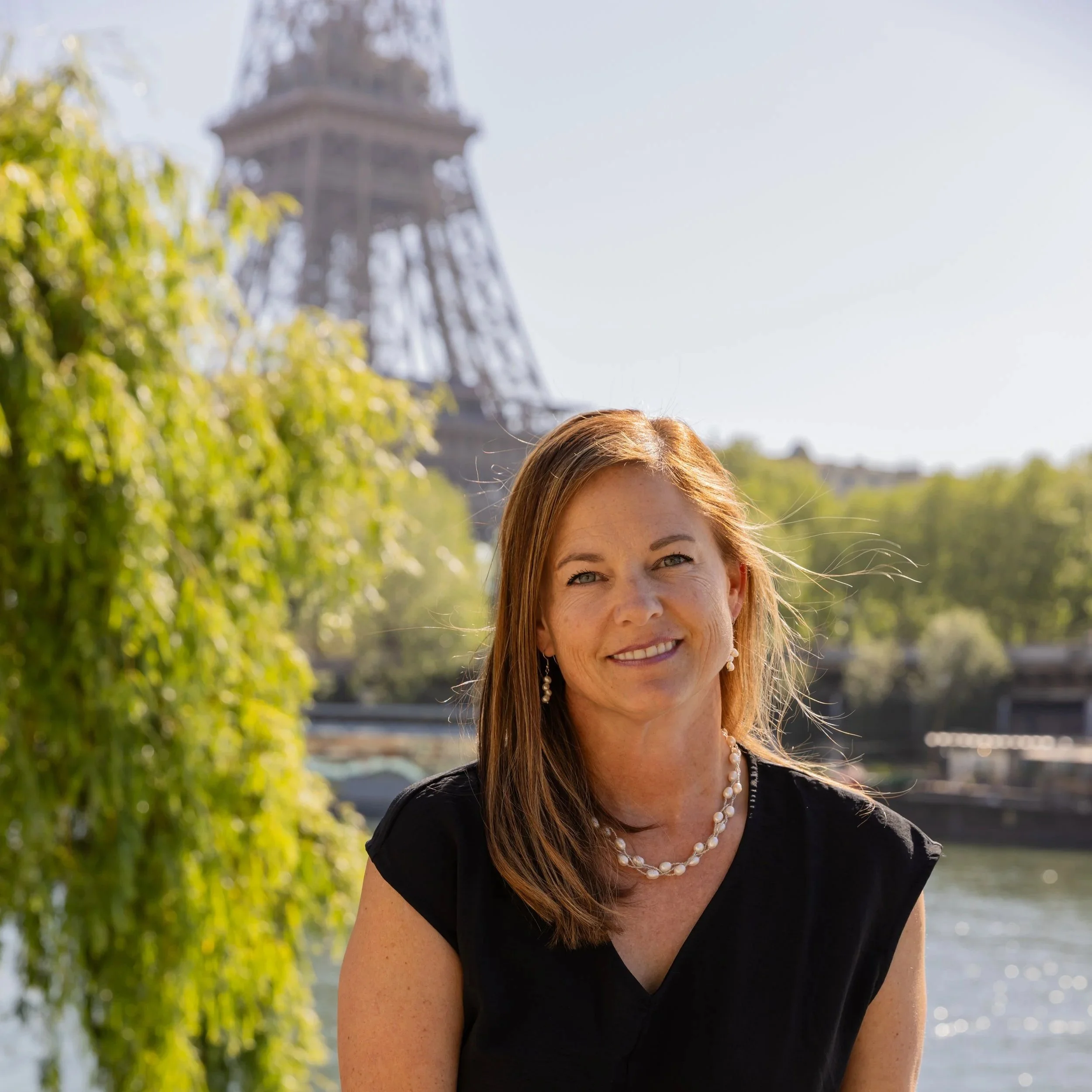 Kimber Travis, founder of Thirsty Bird Travel and owner of Coeur d'Alene Cellars, a luxury travel advisor specializing in food and wine experiences.