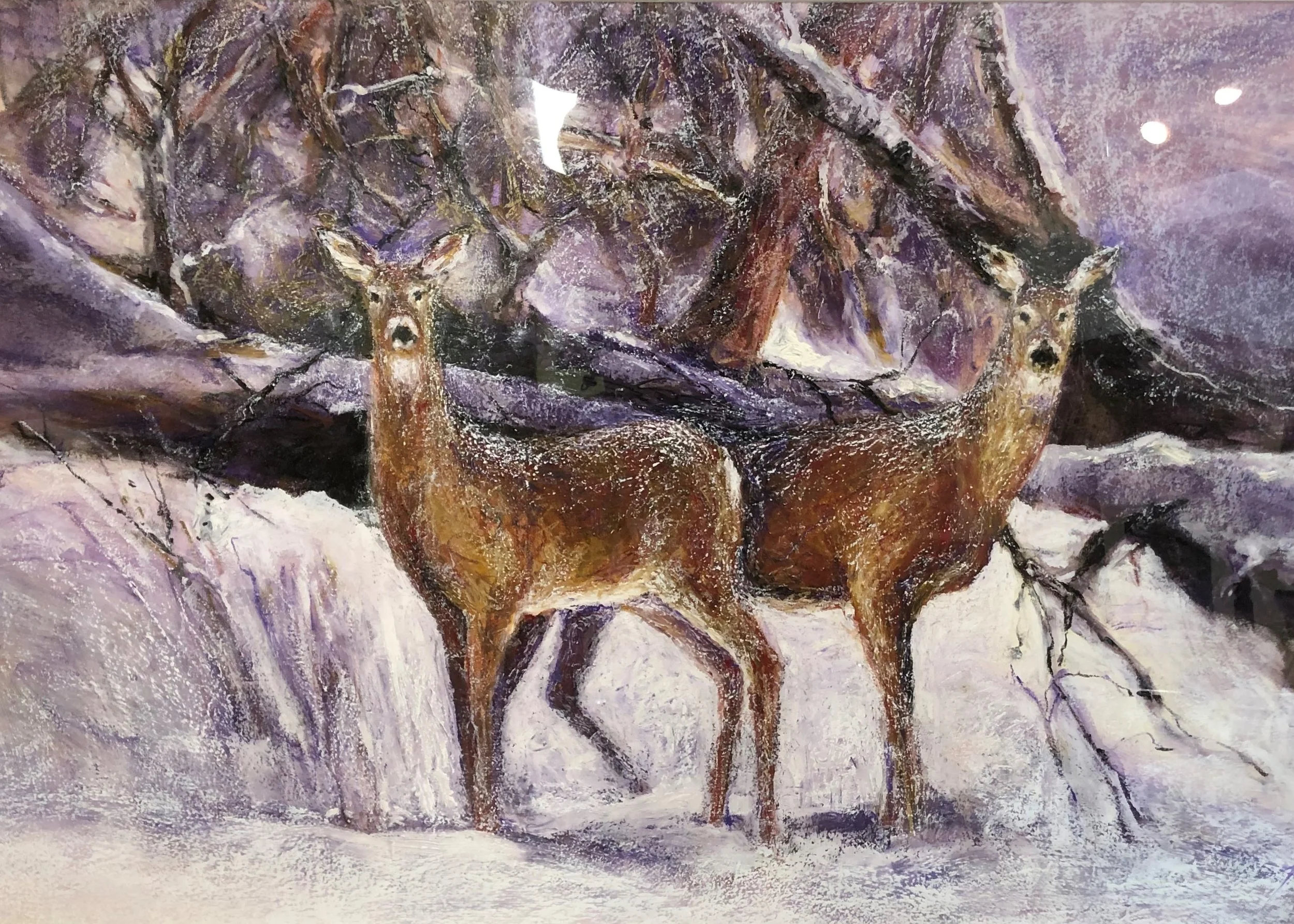 A painting featuring two deer standing in snowy terrain with a snowy, mountainous background and leafless trees.