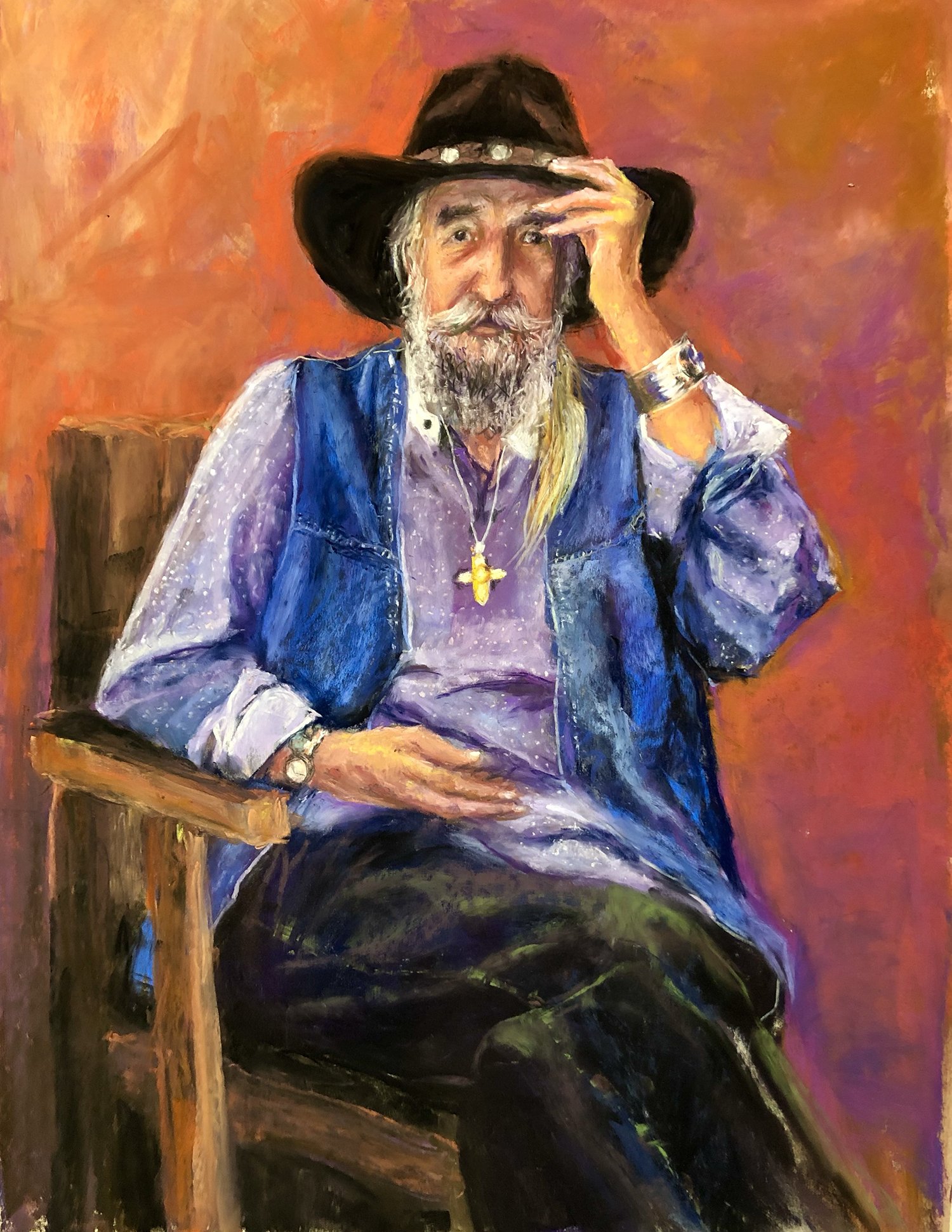 Painting of an old man sitting on a wooden chair, wearing a black cowboy hat, a purple shirt, a blue vest, and dark pants. He has a long white beard and mustache, with a long gray hair piece, and is wearing a gold cross necklace. He is holding his ha