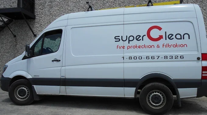 White commercial van with a logo and text for "Super G Clean, fire protection & filtration," along with a phone number "1-800-667-8326" on the side.