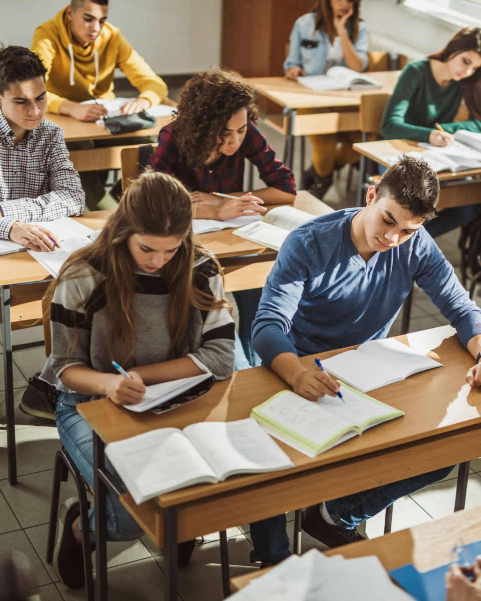 Students preparing for the ACT & SAT and doing practice questions in a classroom.
