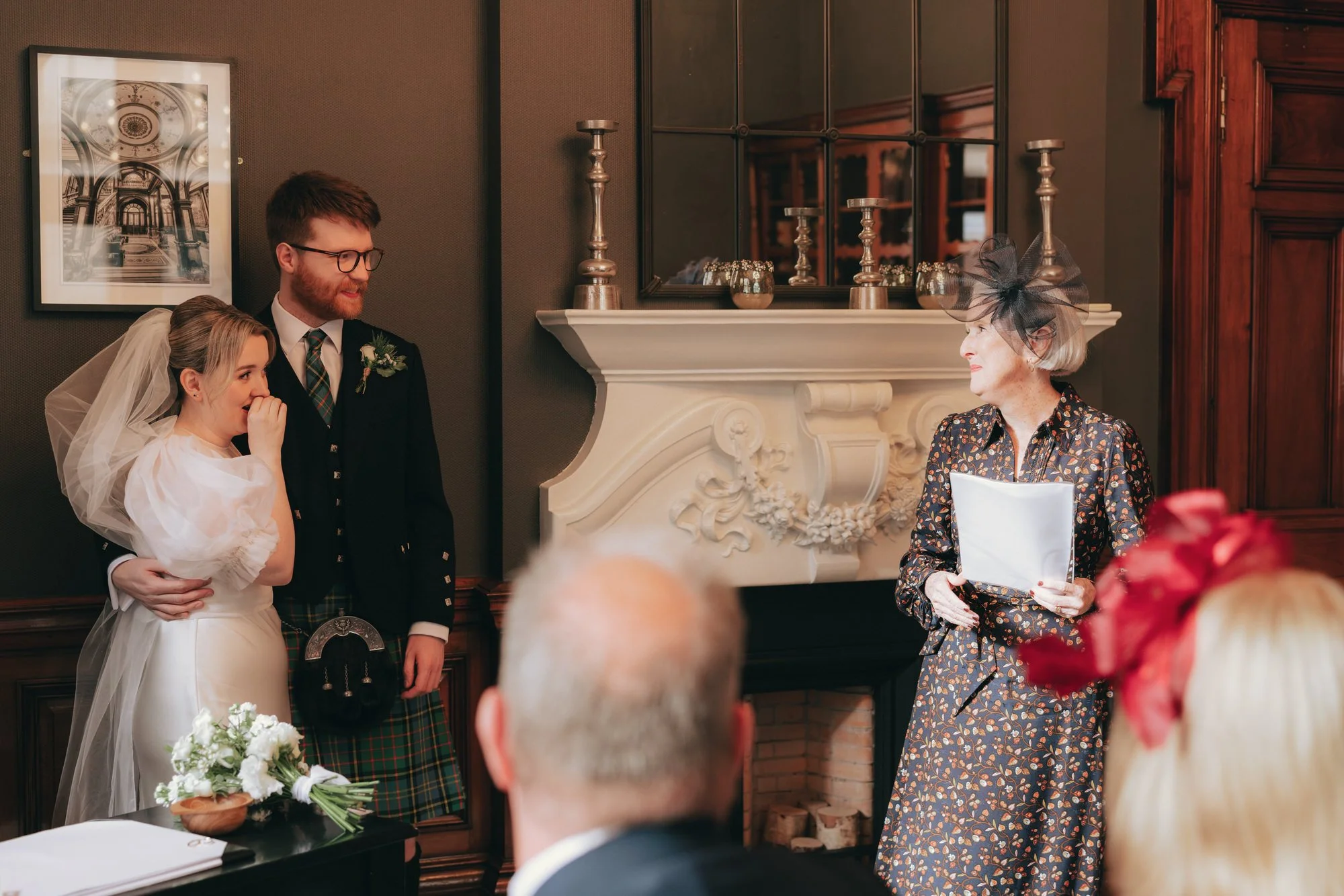 Erin and Matthew exchanging vows at Glasgow City Chambers registry office