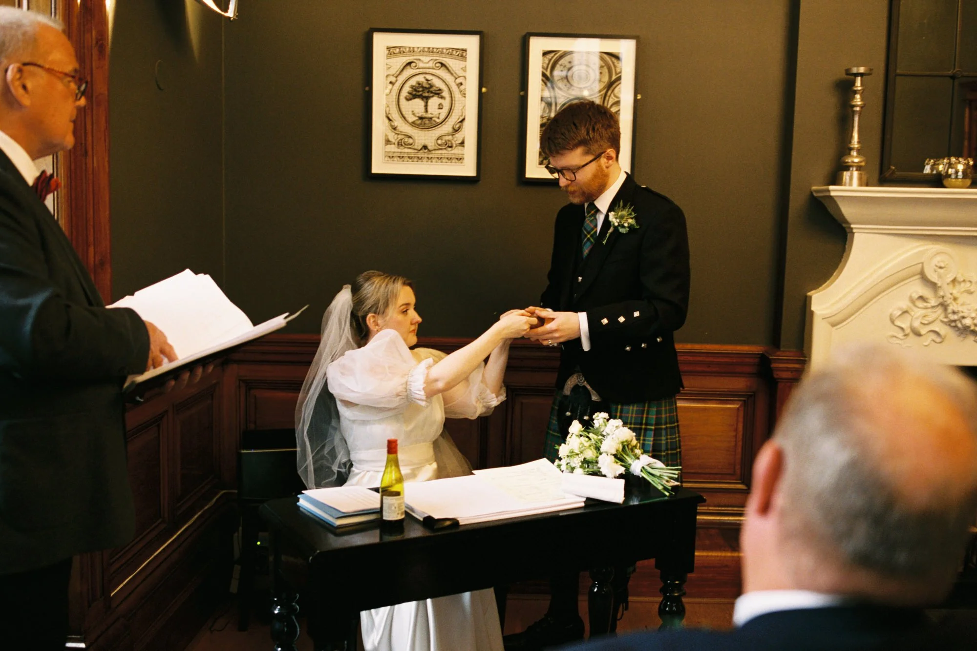 Erin and Matthew exchanging vows at Glasgow City Chambers registry office