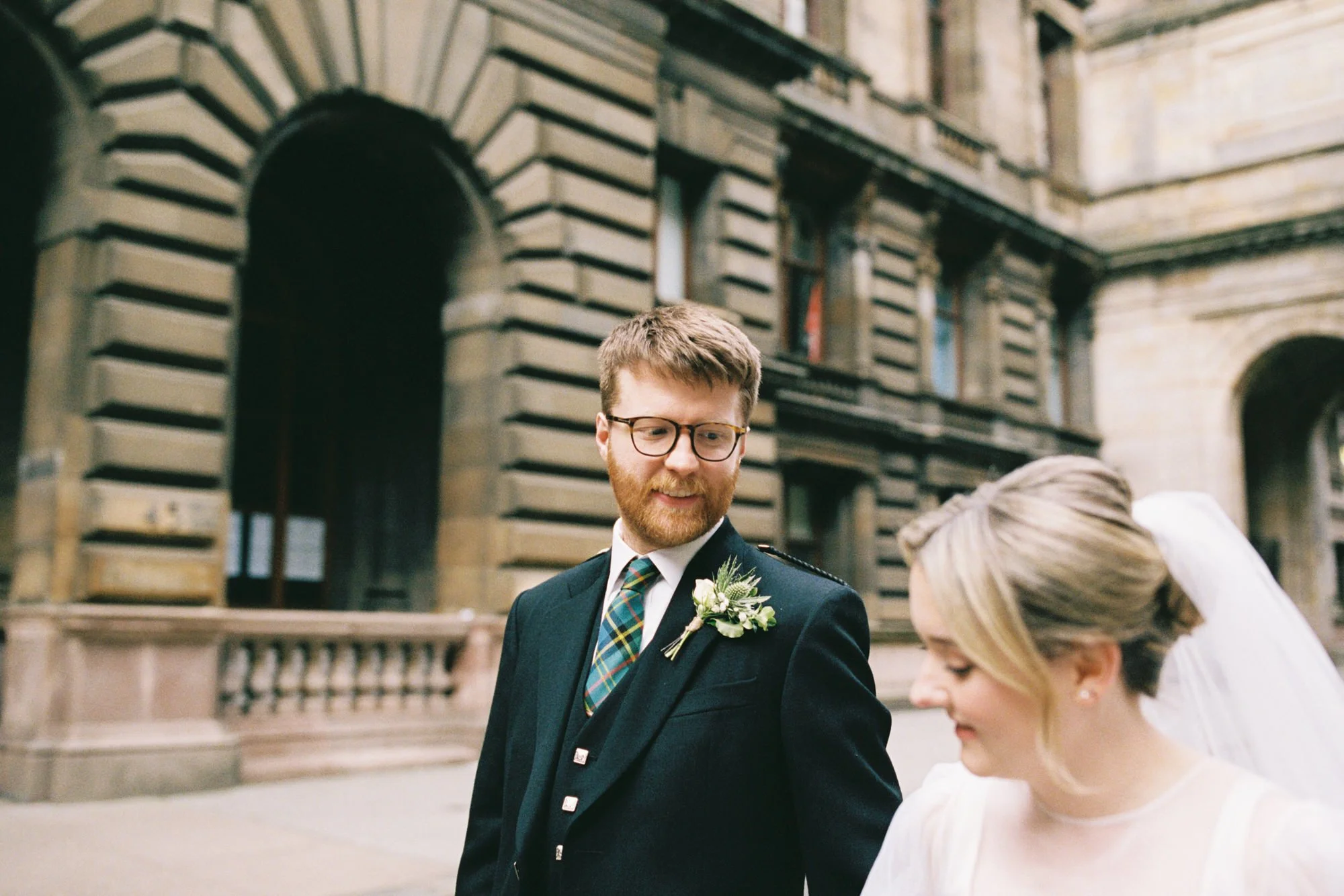 Relaxed newlywed portrait beside the autumn trees on Kelvin Way