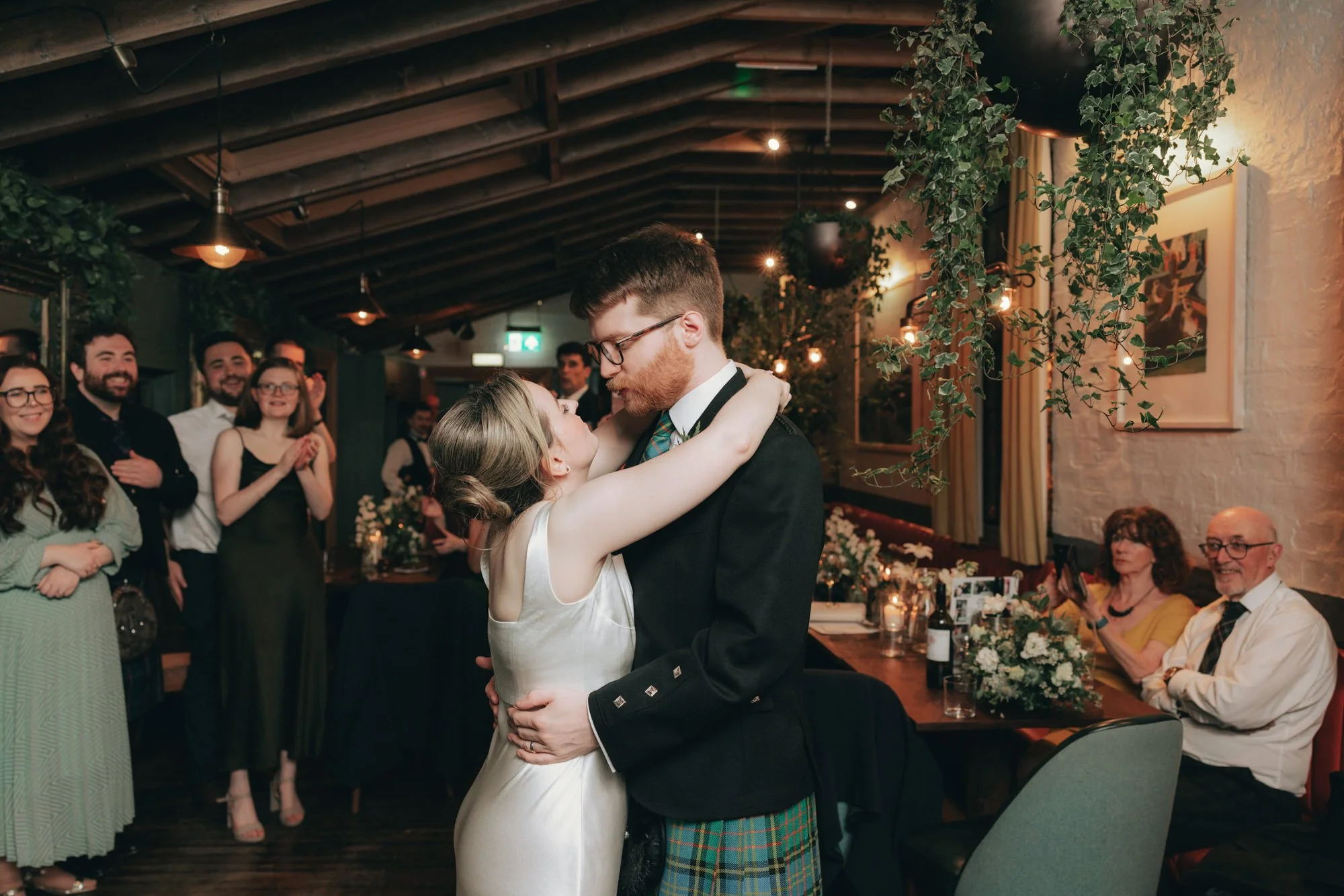 Friends and family during dinner at Erin and Matthew’s Glasgow wedding