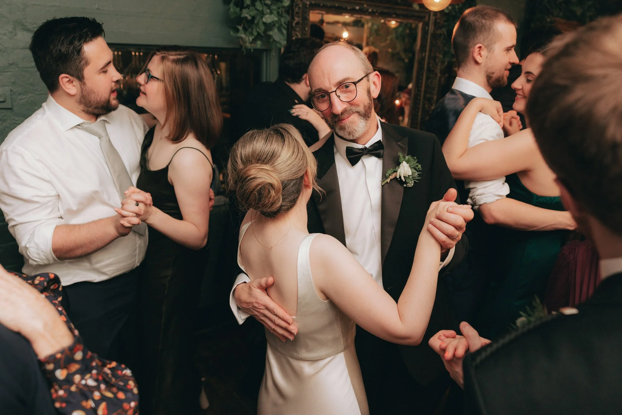 A warm, candid moment from Erin and Matthew’s Glasgow wedding evening