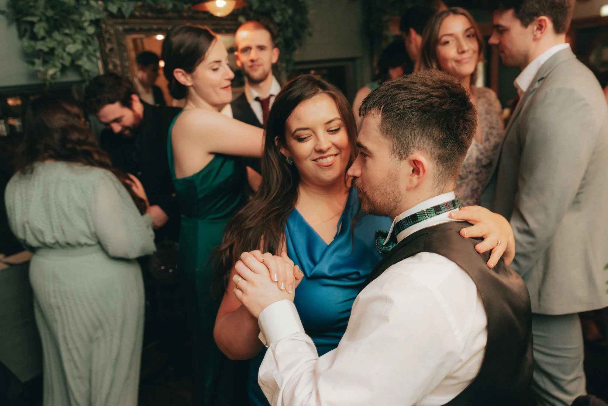 Guests celebrating Erin and Matthew’s wedding at the Ubiquitous Chip