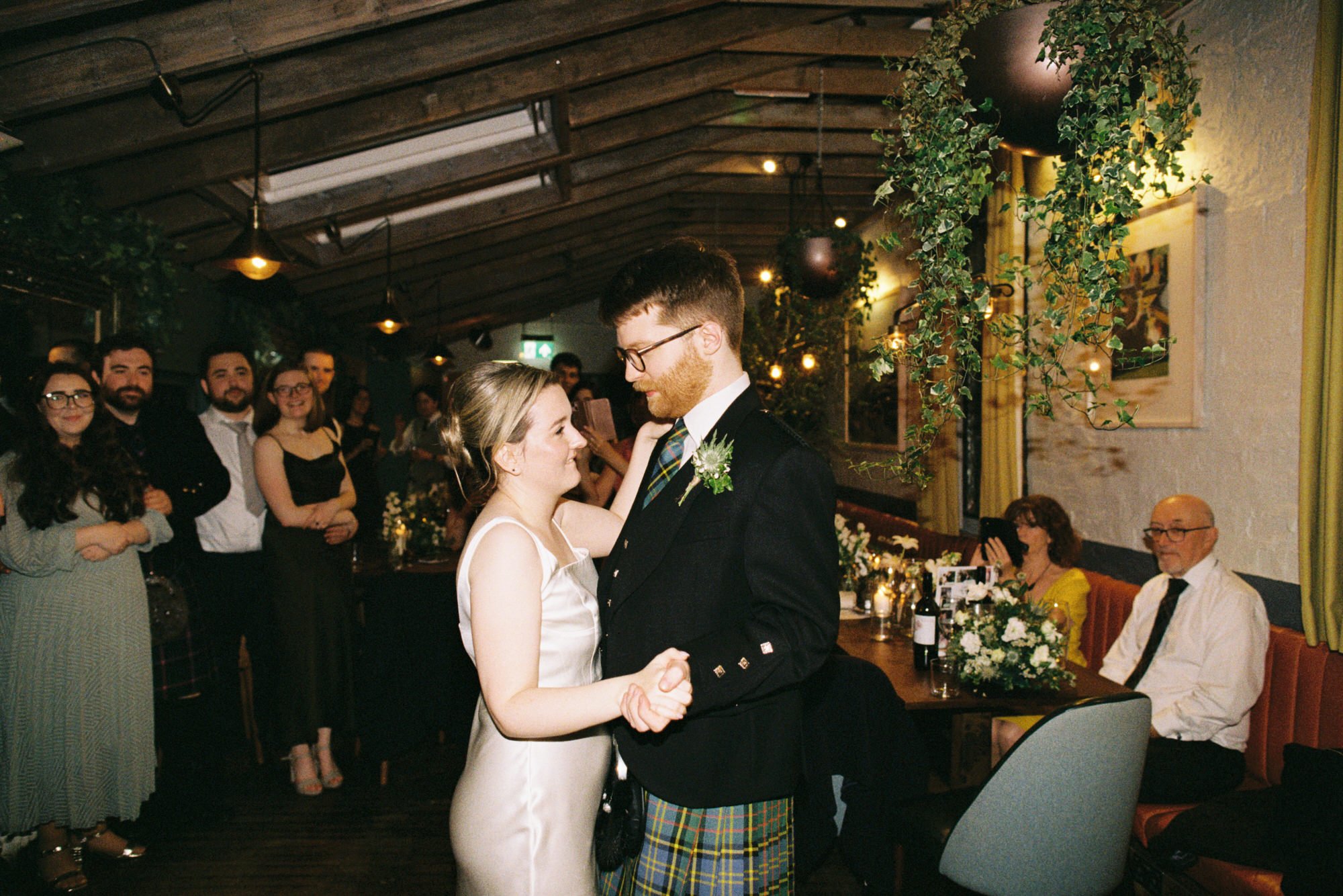 Candid evening photograph from the Ubiquitous Chip wedding reception