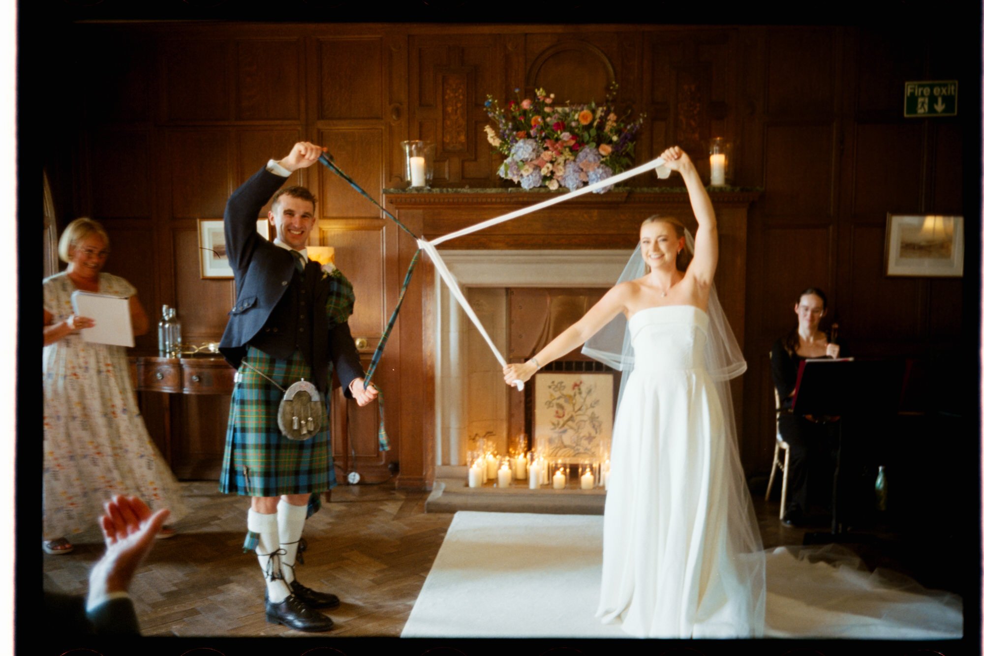 Iona and Lewis exchanging vows at Rowallan Castle