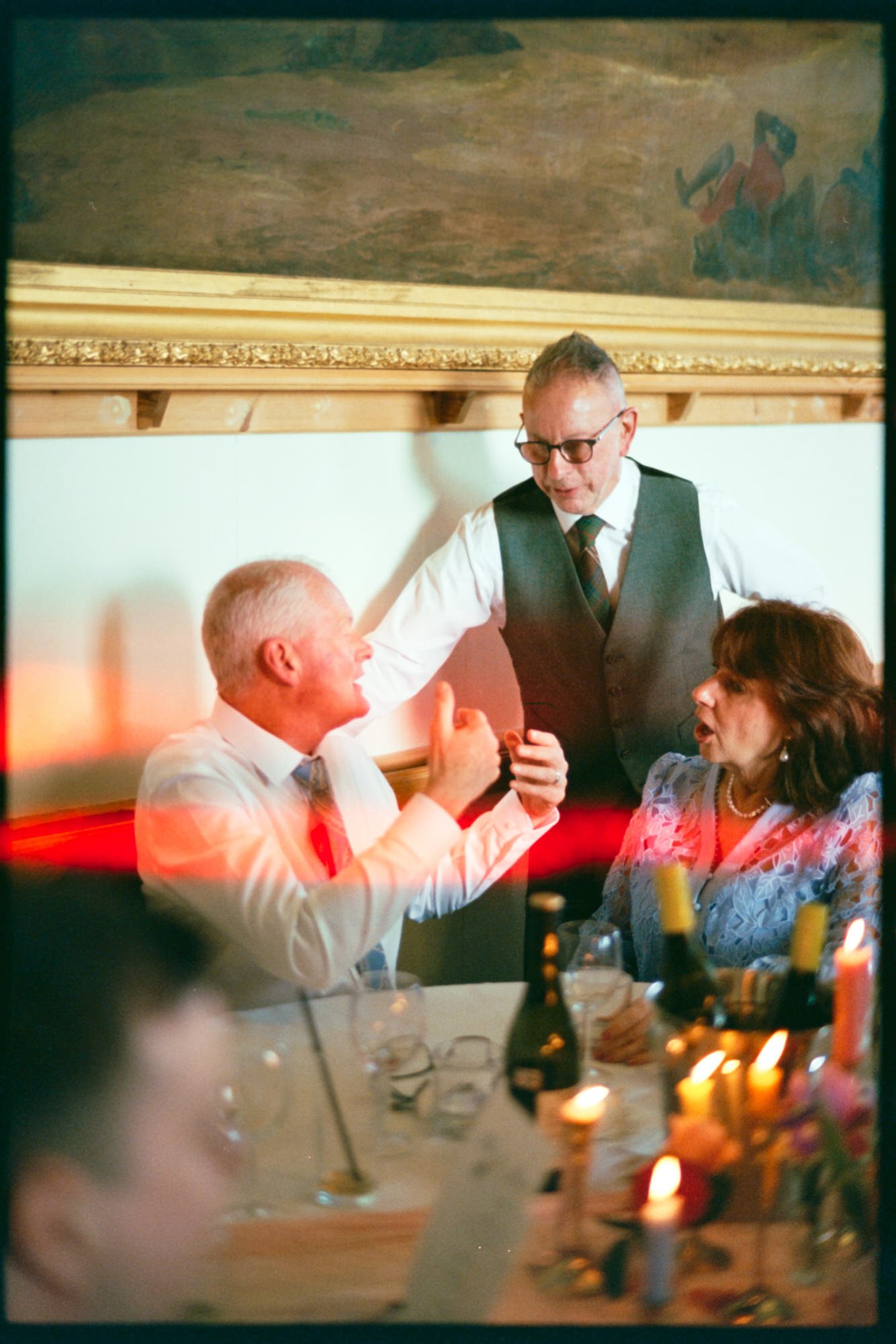 Warm candlelight and flowers at the wedding dinner