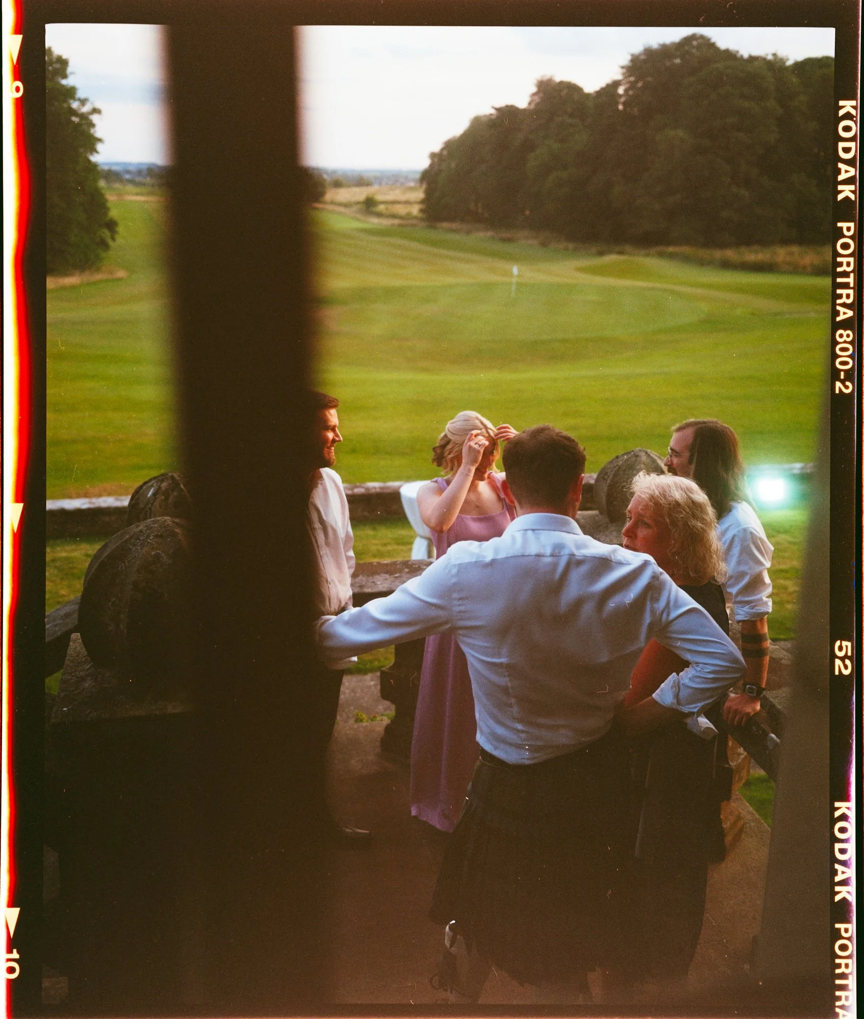 Guests on the terrace during a Rowallan Castle wedding