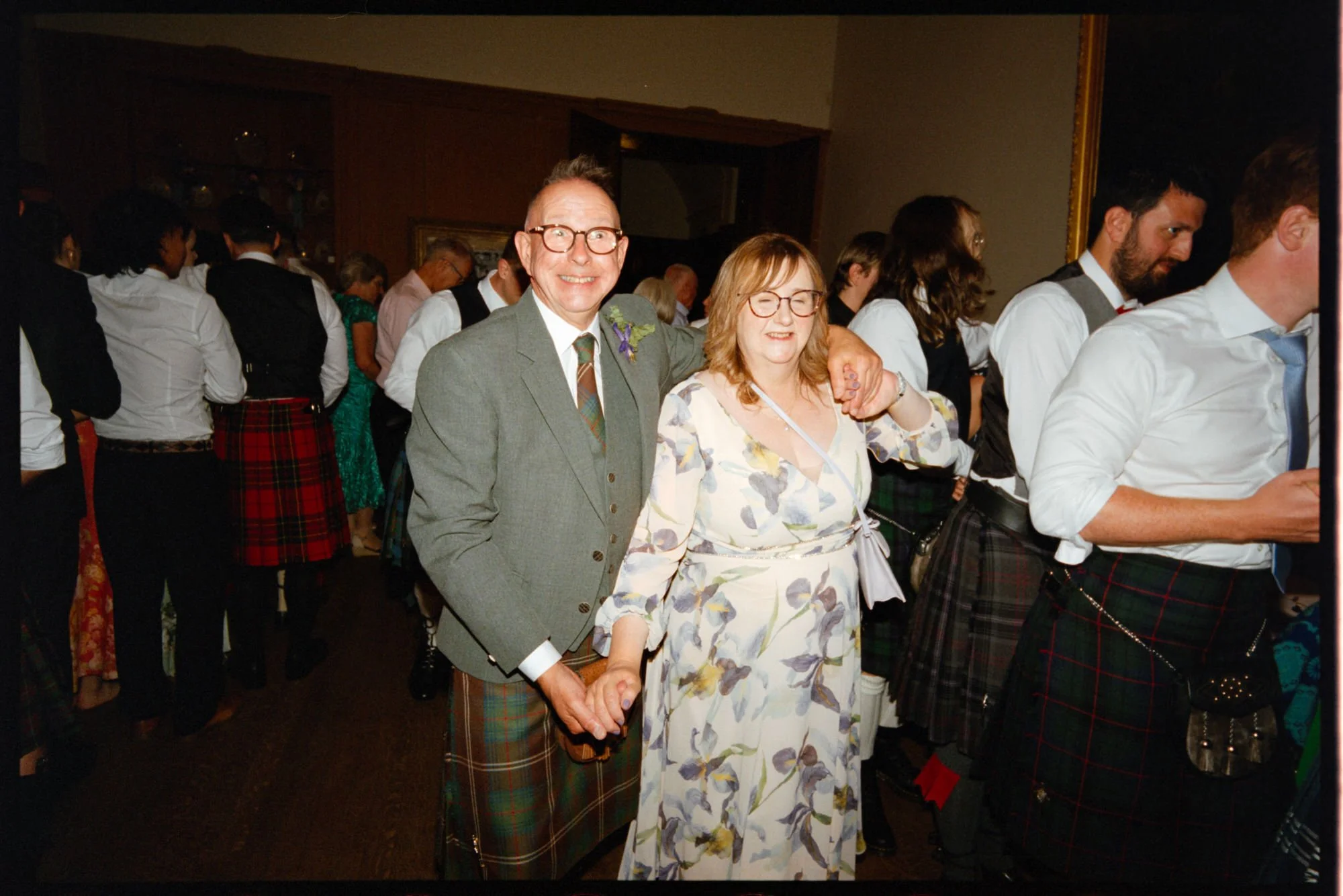 Wedding guests celebrating inside Rowallan Castle