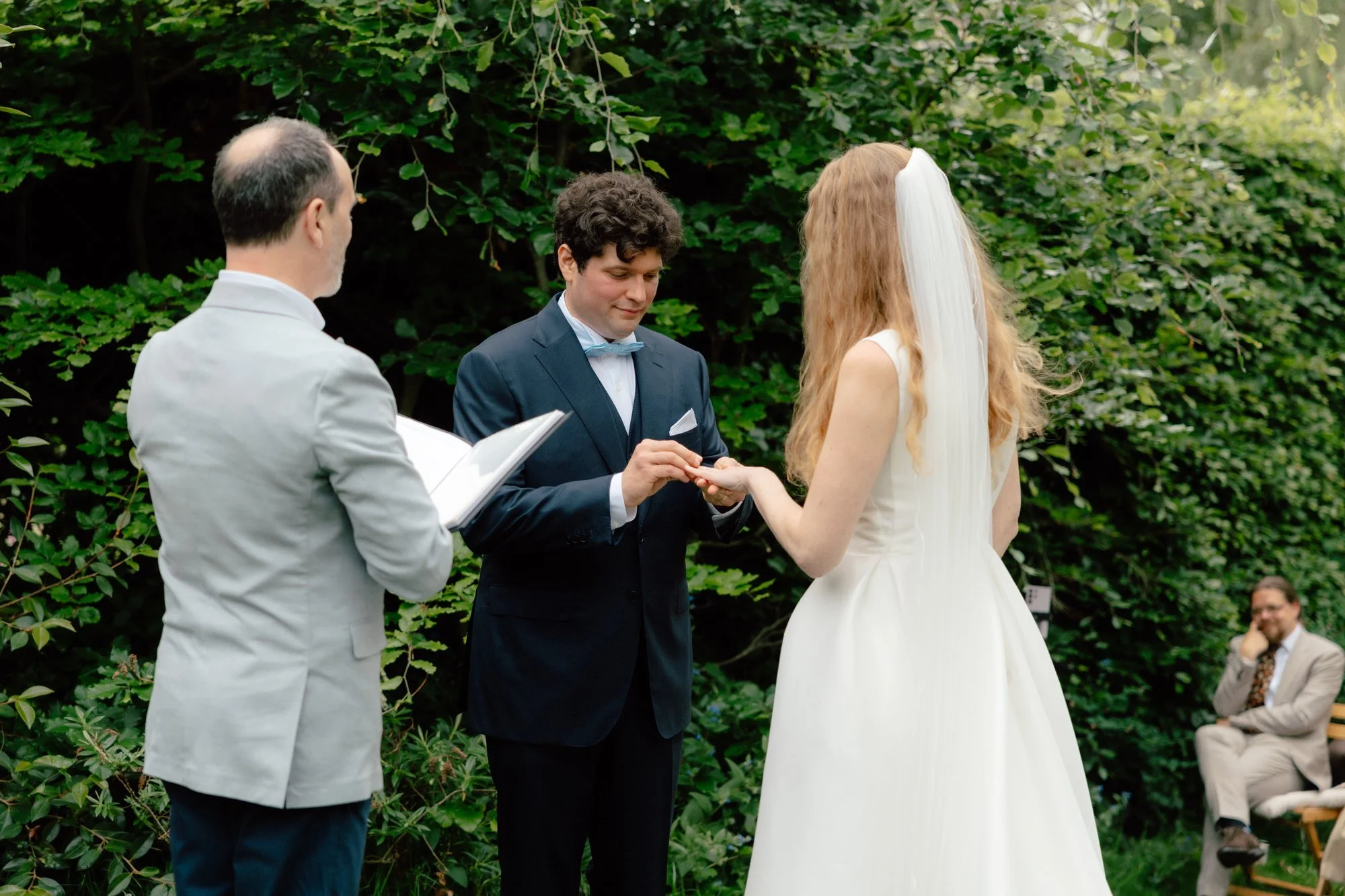 Guests gathered closely for an intimate Edinburgh garden ceremony