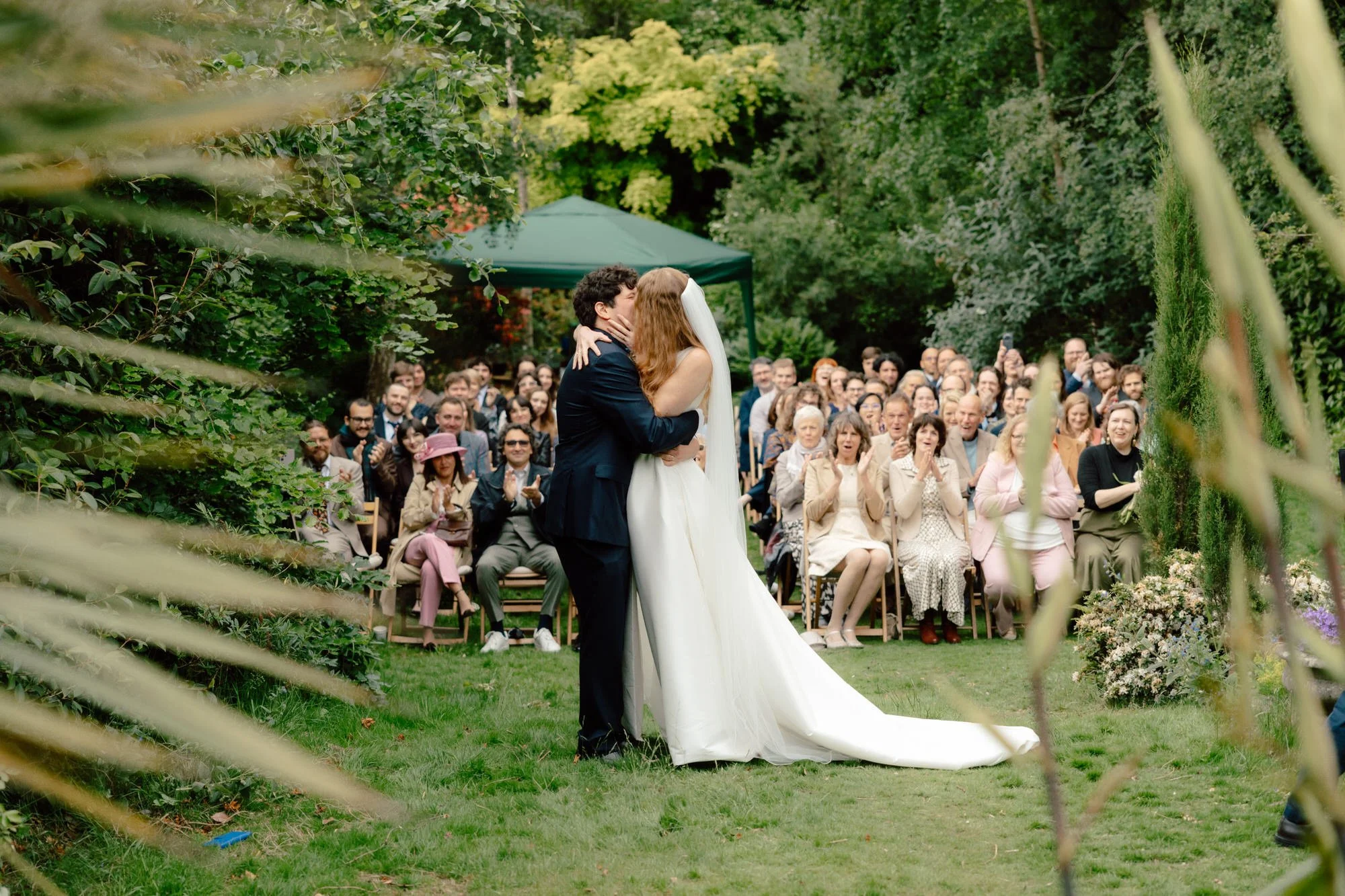 Newlyweds smiling after their relaxed back-garden ceremony