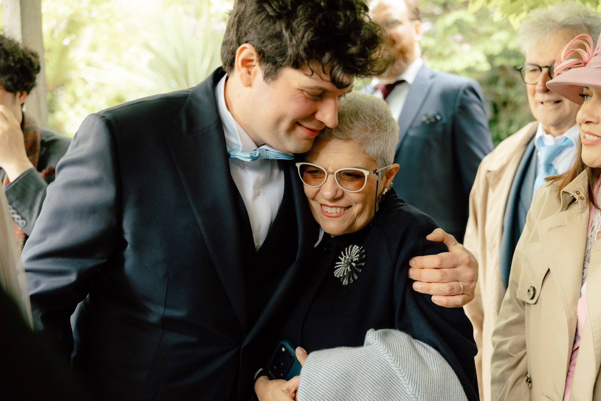 Newlyweds smiling after their relaxed back-garden ceremony