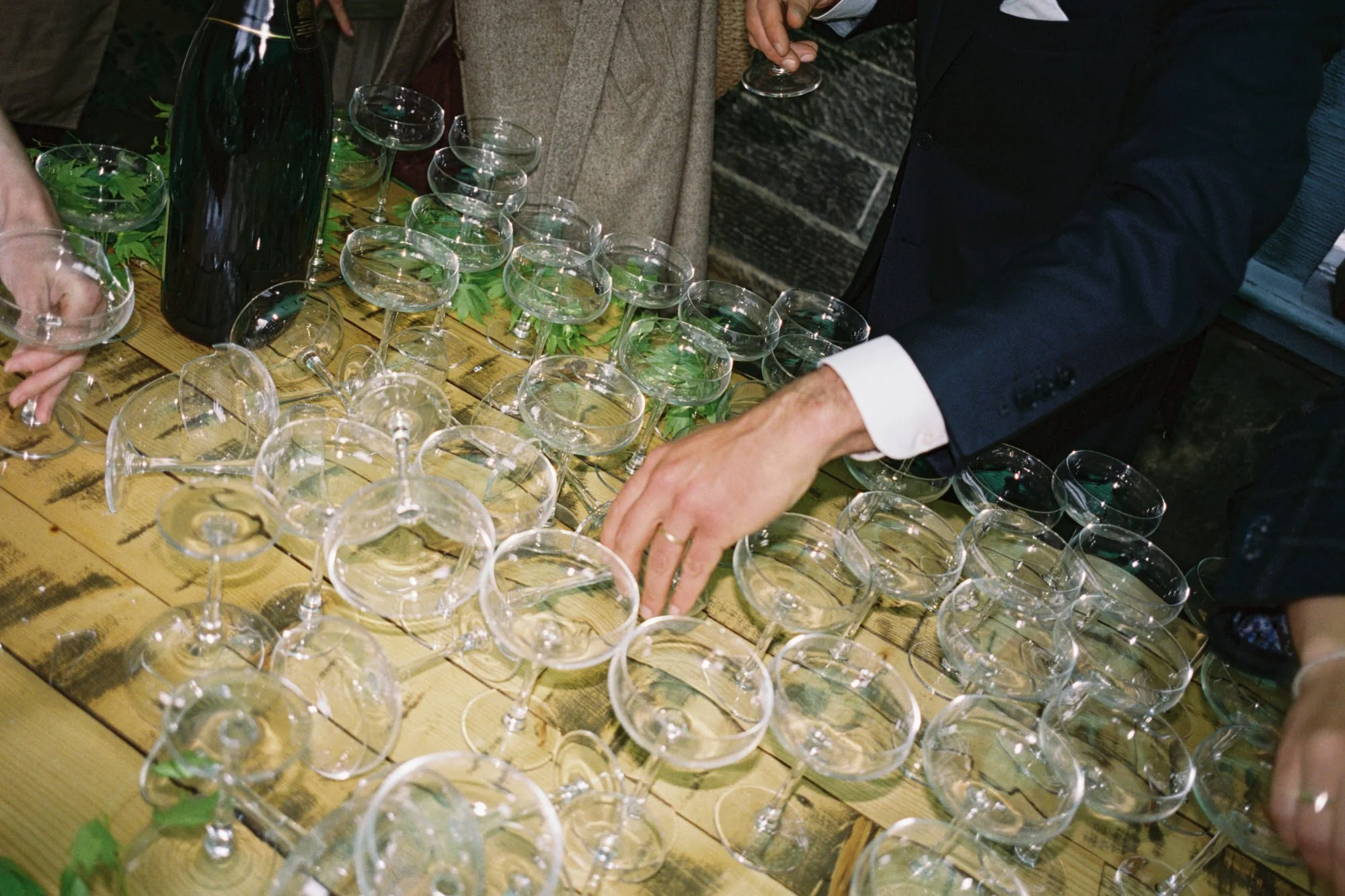 Guests enjoying champagne after an Edinburgh garden wedding