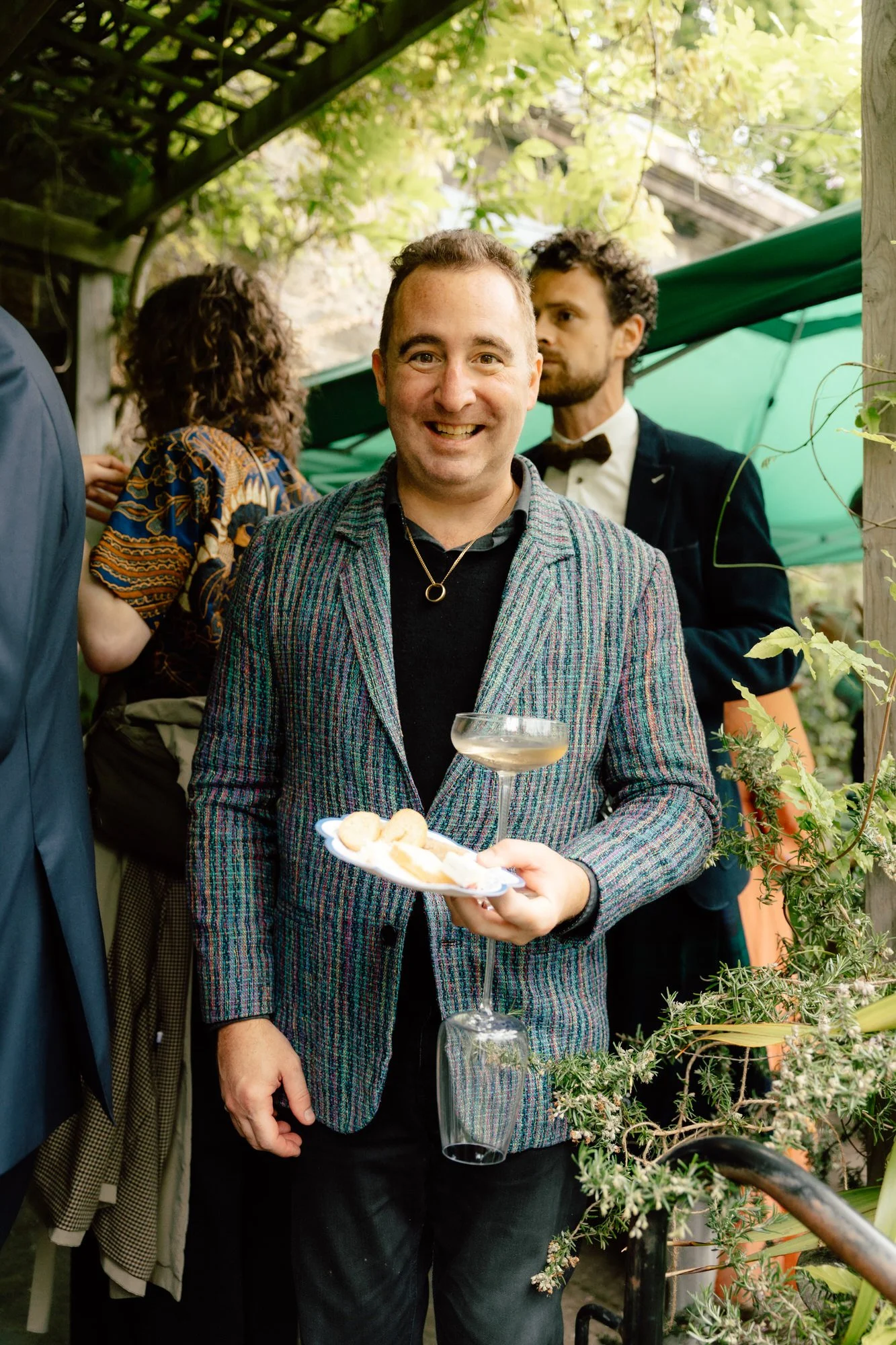 Guests enjoying champagne after an Edinburgh garden wedding